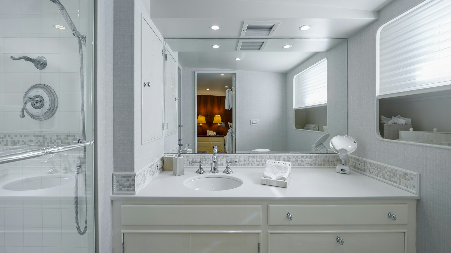a bathroom with a large mirror aboard STONEFACE Yacht for Sale