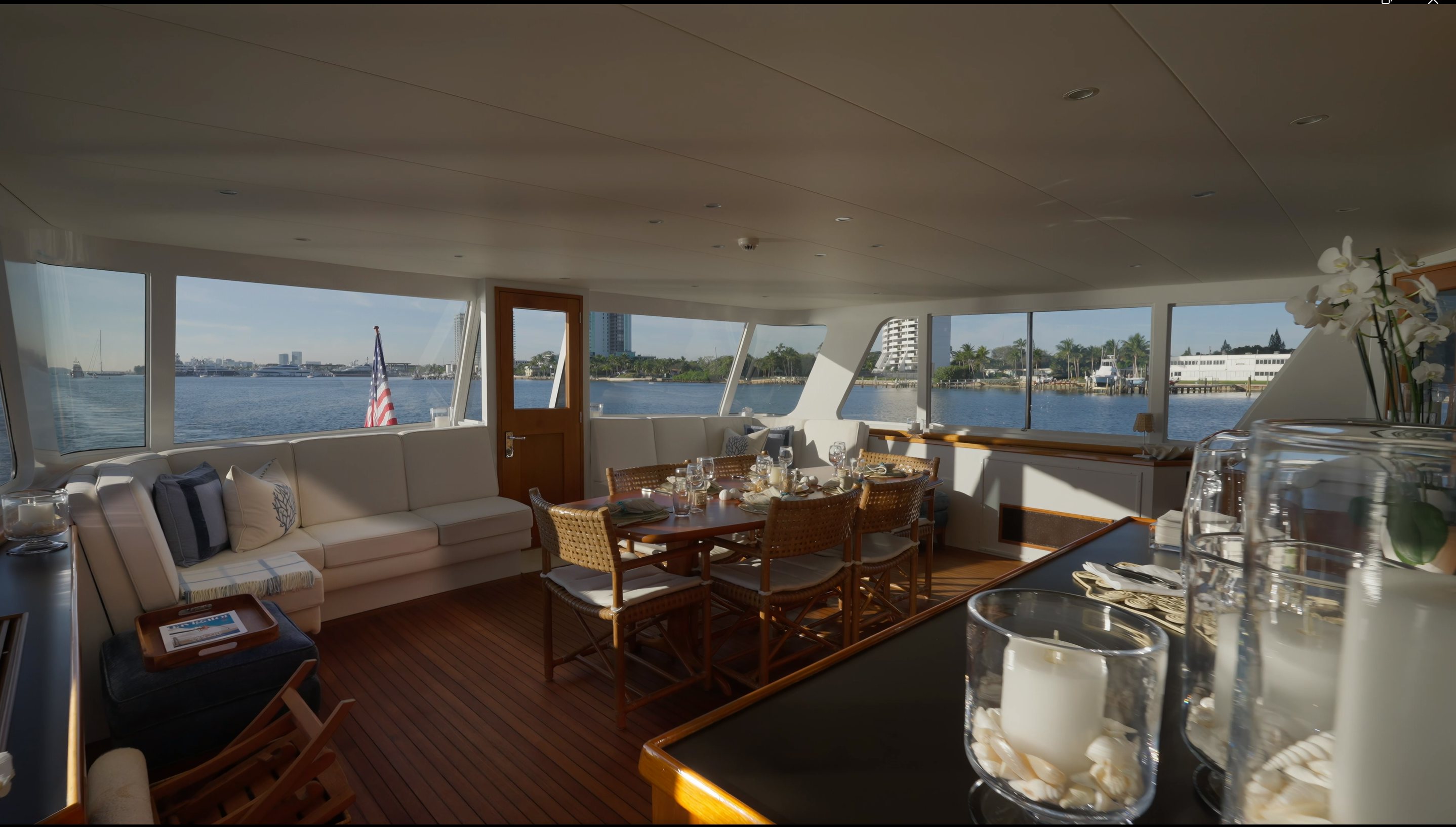 a room with a table and chairs aboard STONEFACE Yacht for Sale