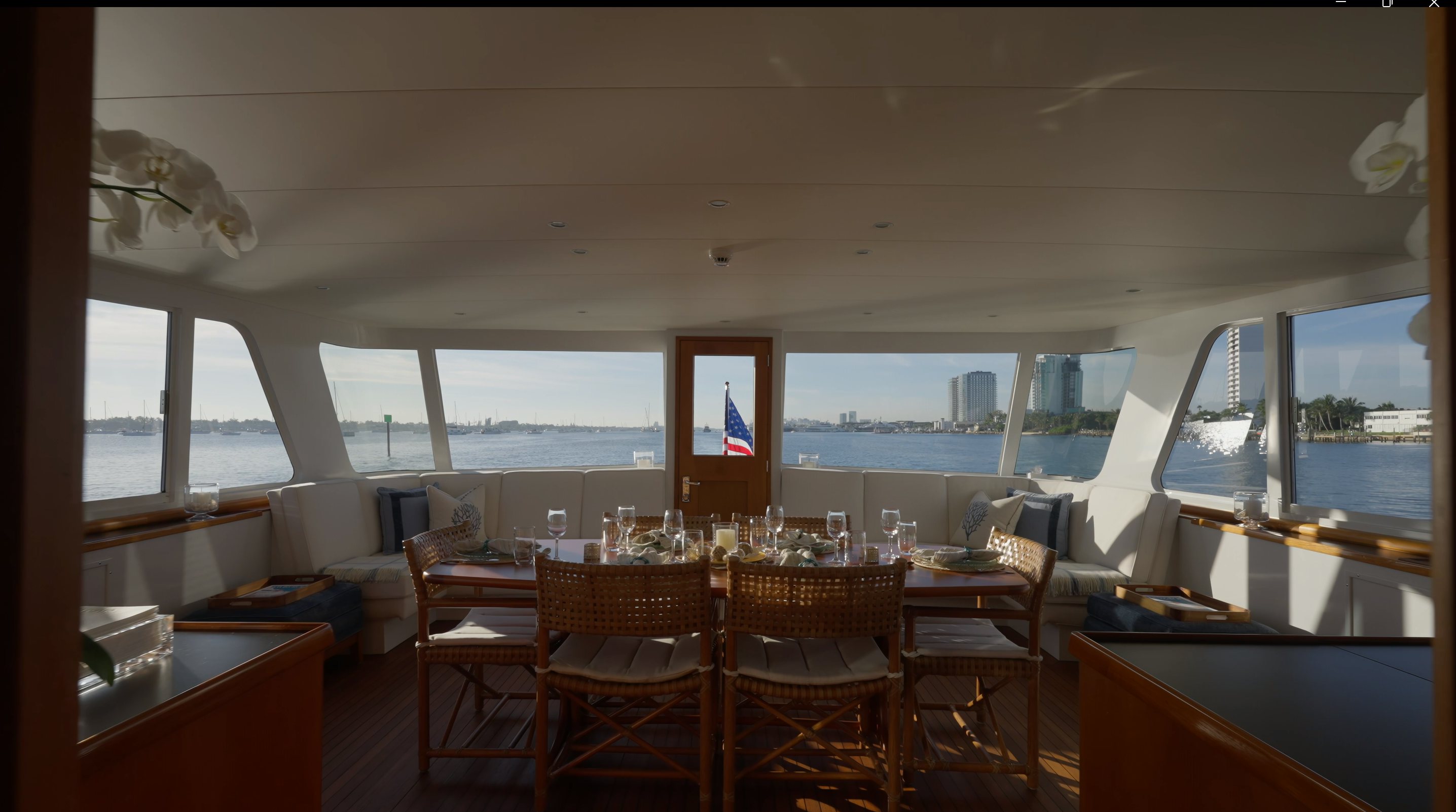 a room with tables and chairs aboard STONEFACE Yacht for Sale