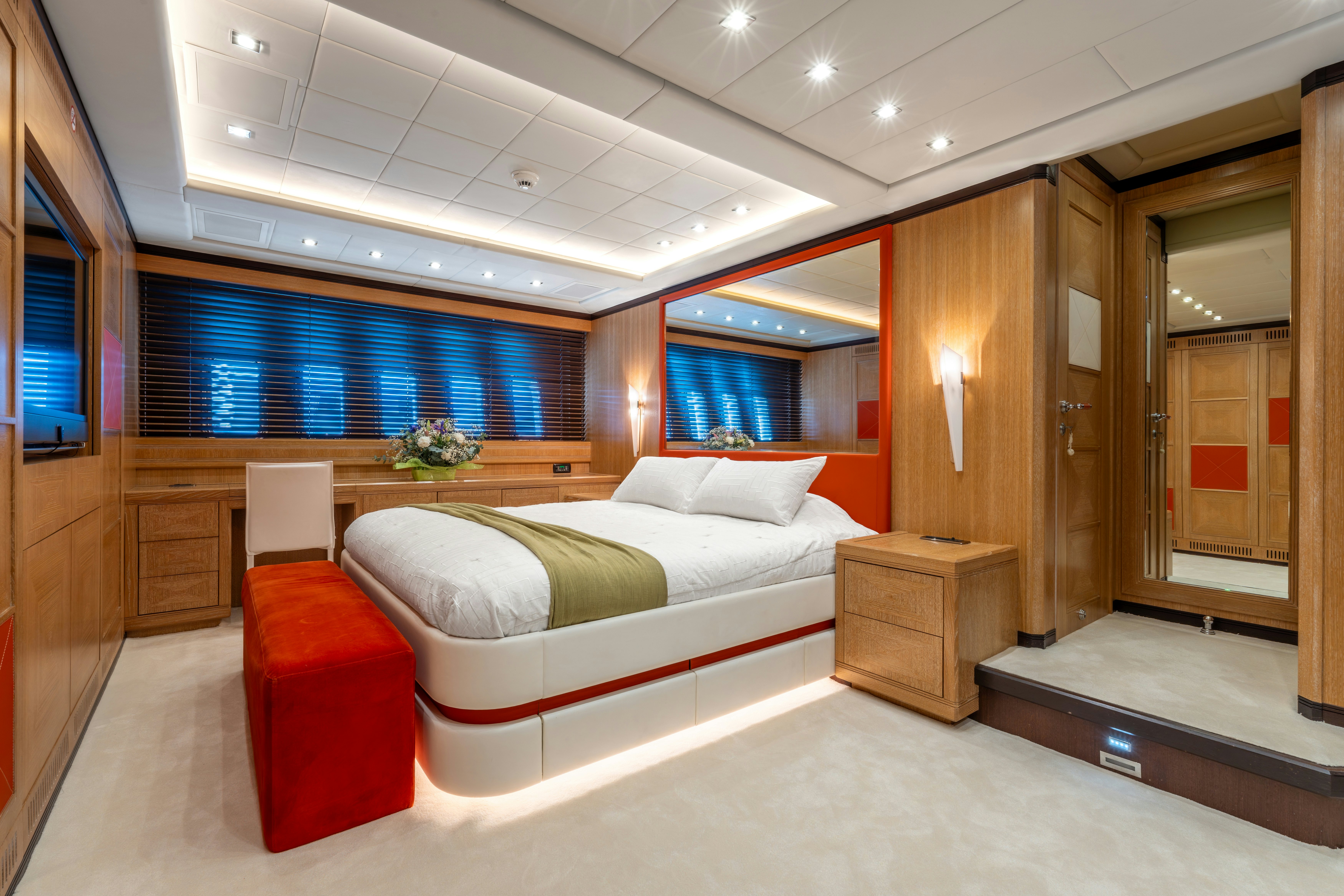a room with a bed and a desk aboard GRAZIADIU Yacht for Sale