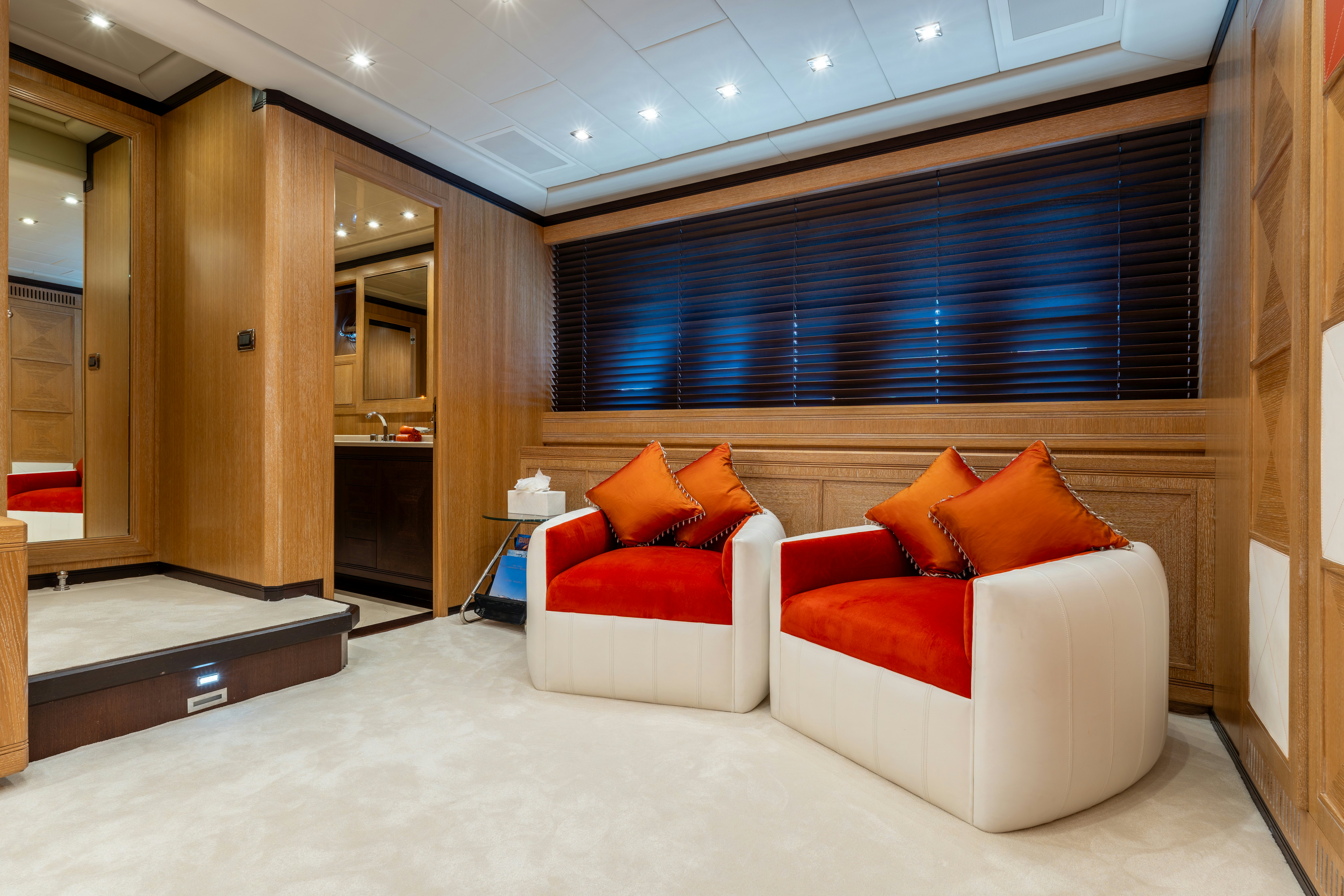 a room with a couch and a mirror aboard GRAZIADIU Yacht for Sale