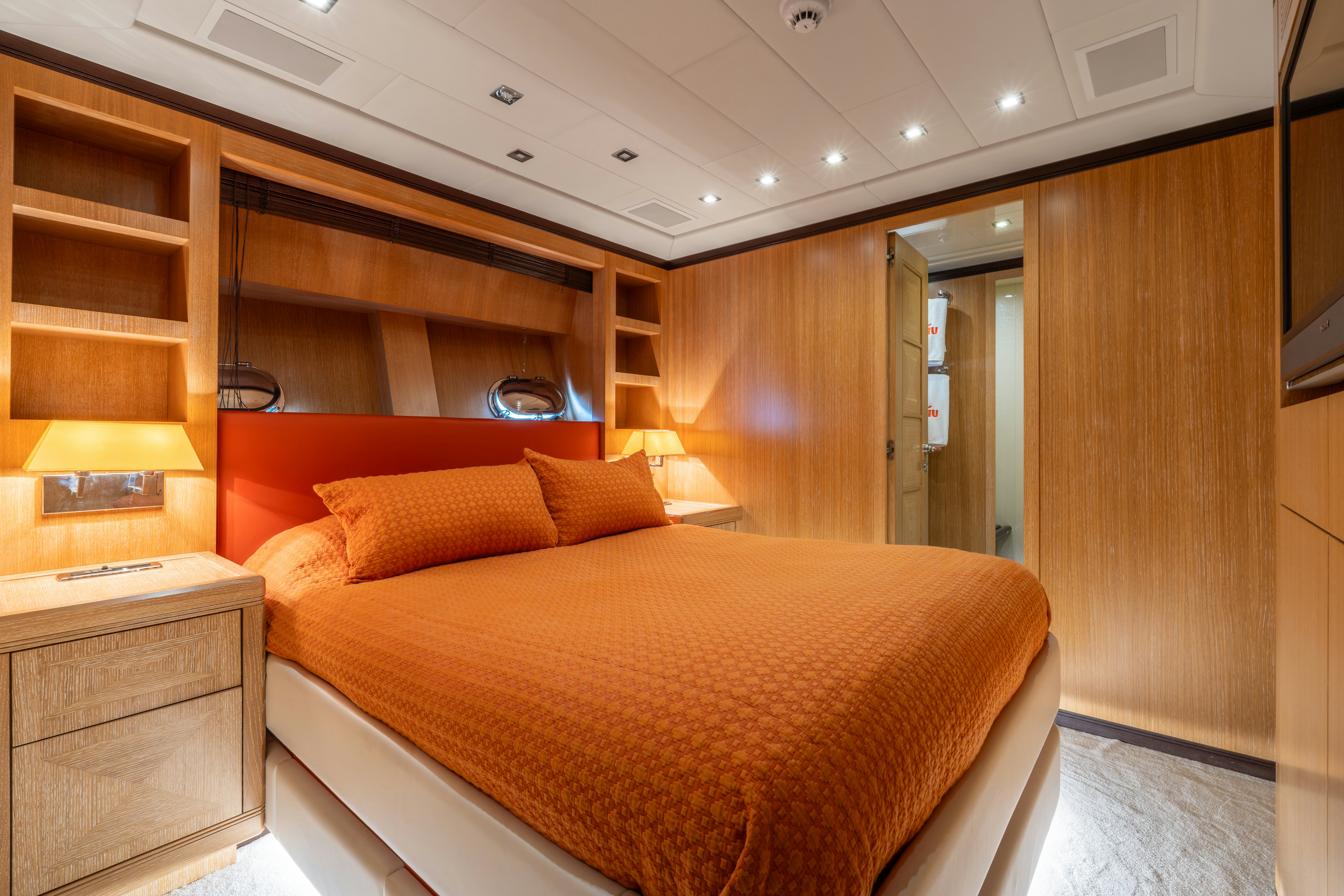 a bedroom with a bed and a desk aboard GRAZIADIU Yacht for Sale
