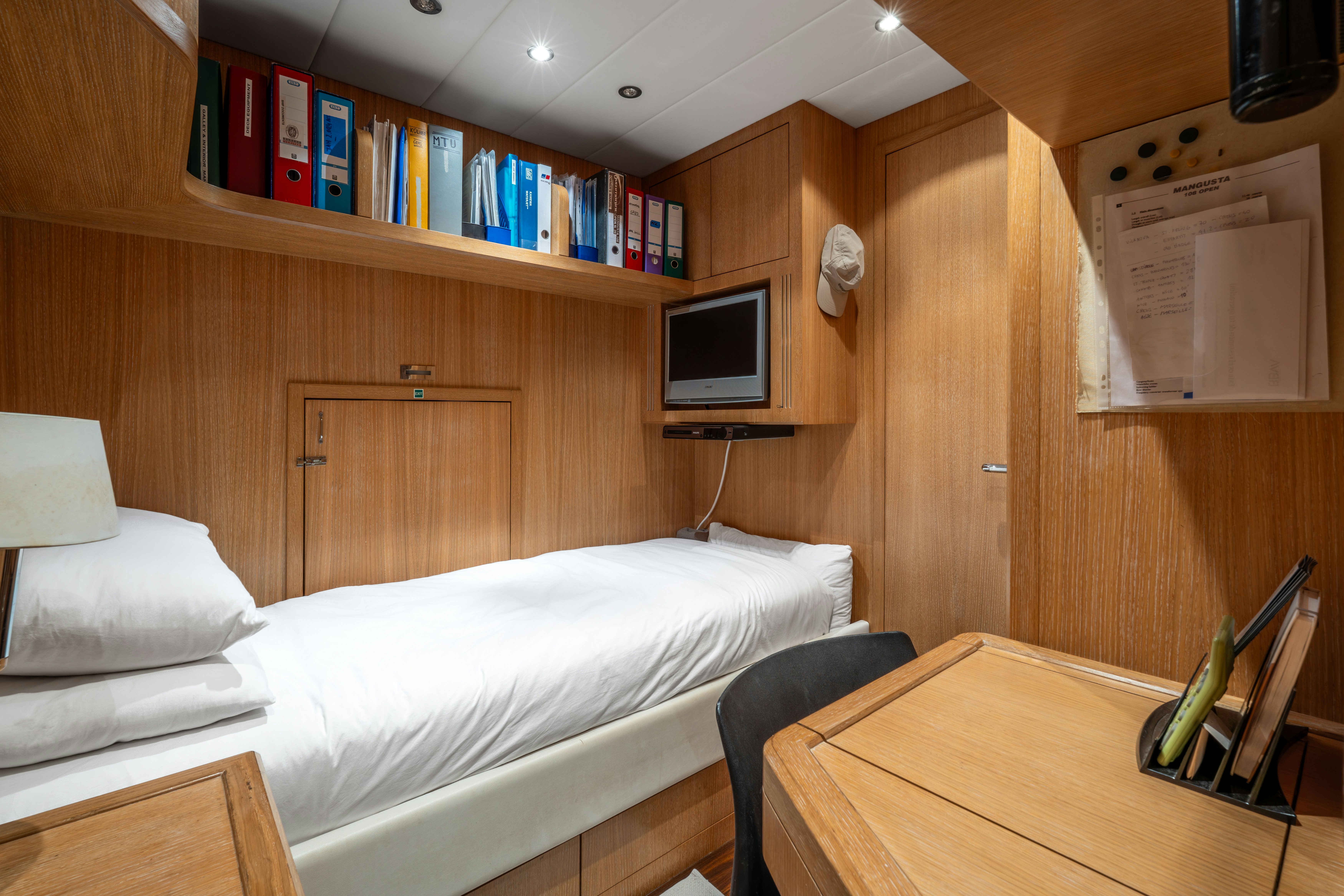 a room with a desk and a bed aboard GRAZIADIU Yacht for Sale