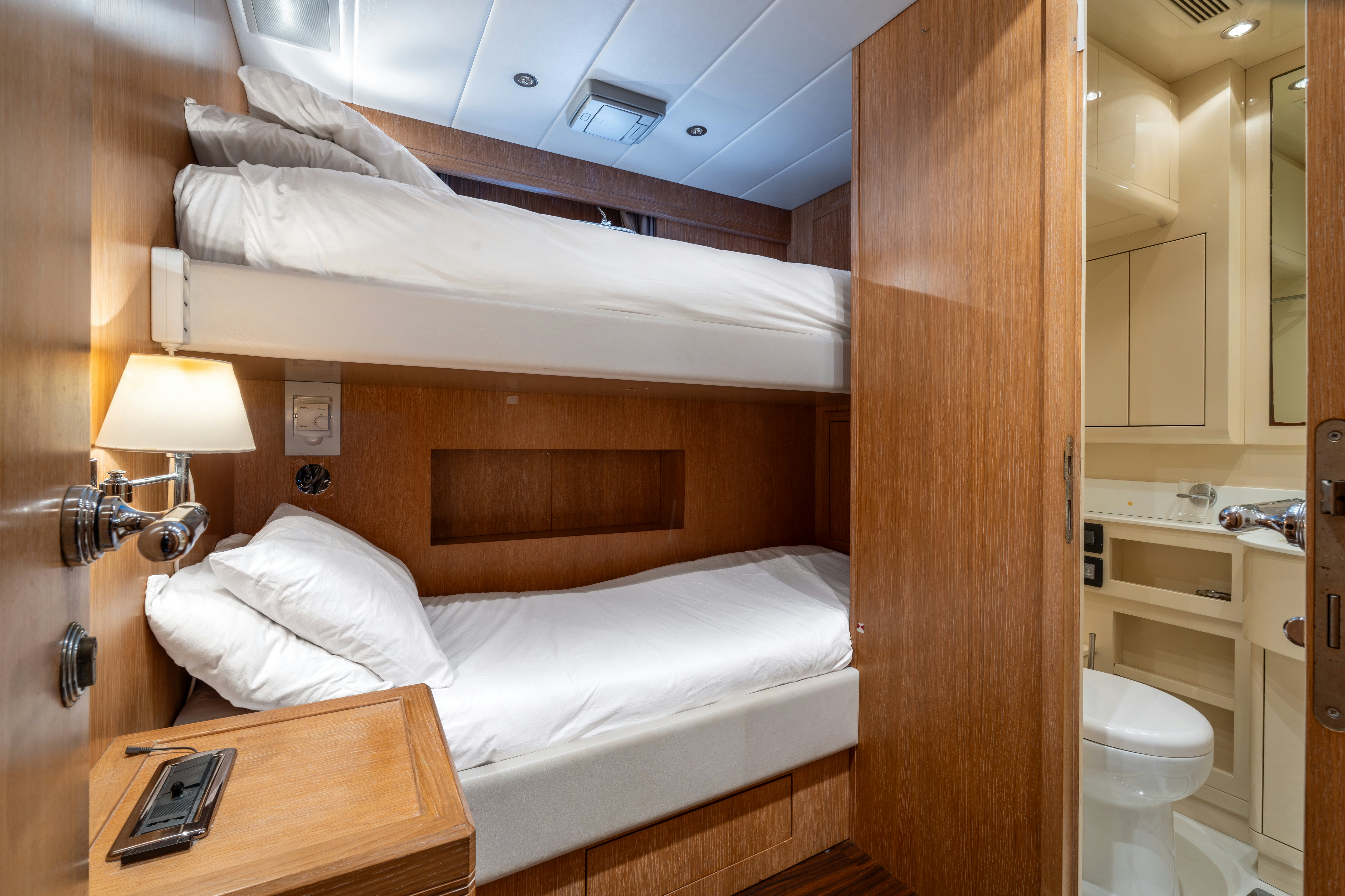 a bed in a room aboard GRAZIADIU Yacht for Sale