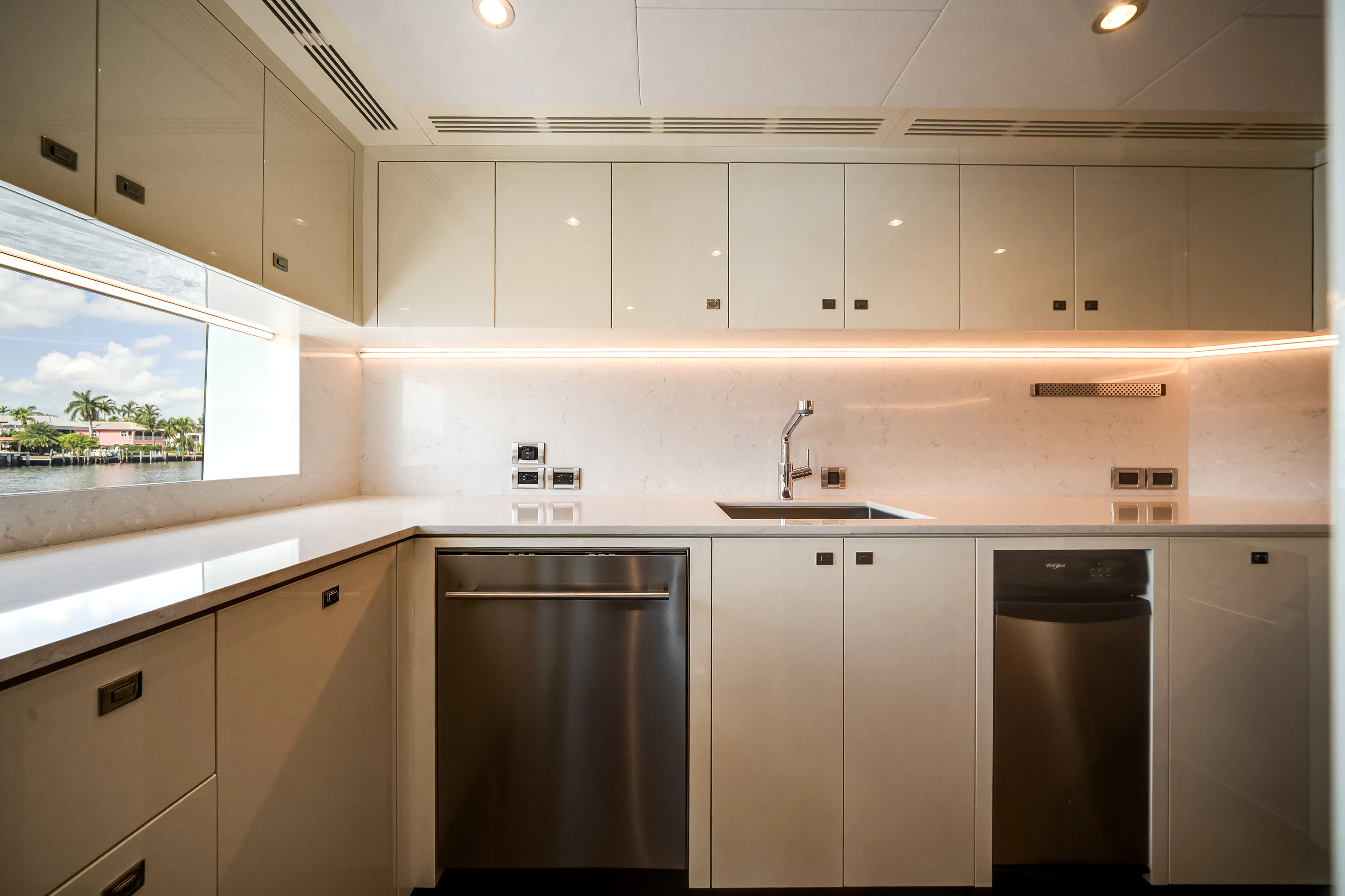 a kitchen with a large window aboard STILL WATERS Yacht for Sale
