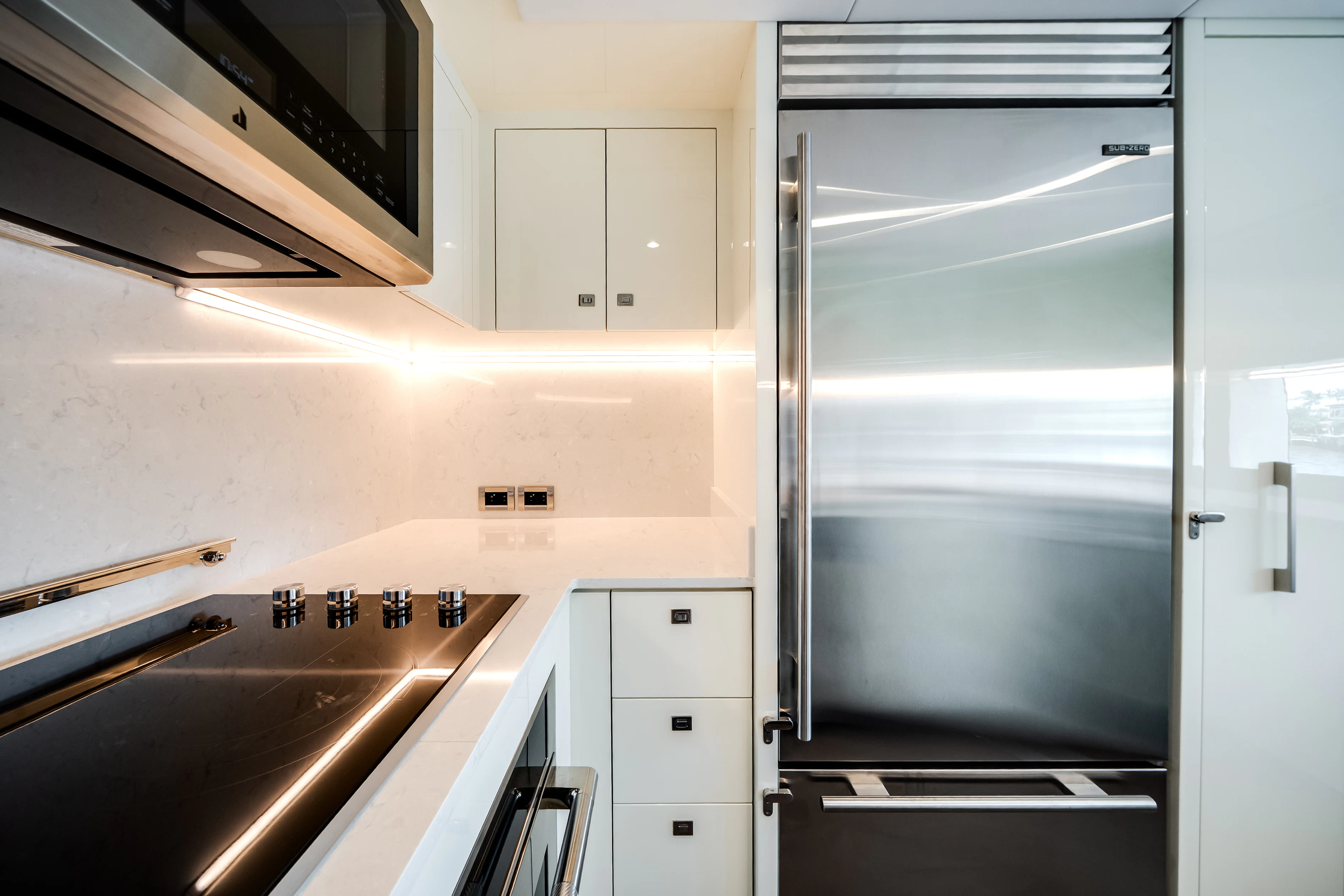 a stainless steel refrigerator in a kitchen aboard STILL WATERS Yacht for Sale