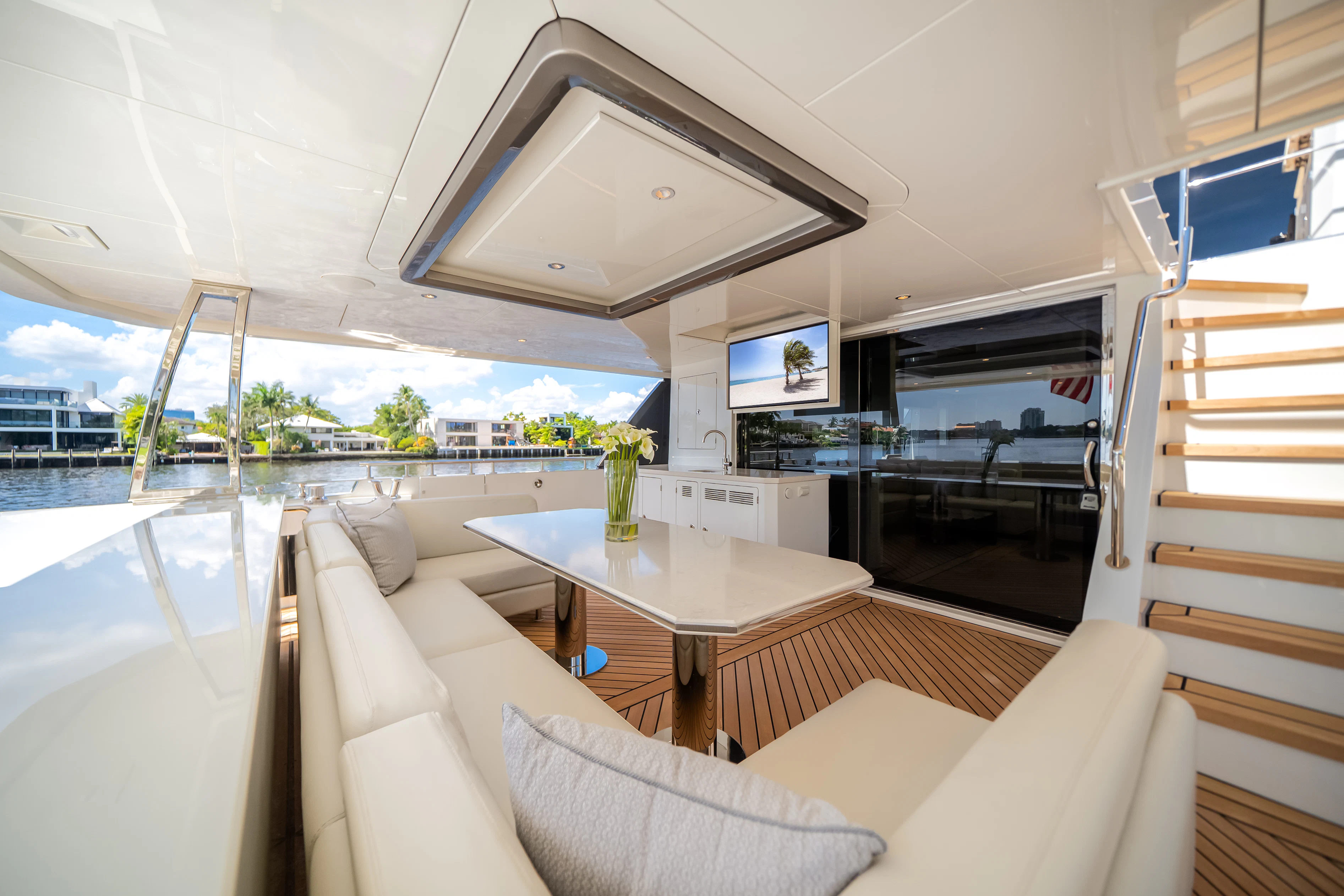 a living room with a table and couches aboard STILL WATERS Yacht for Sale