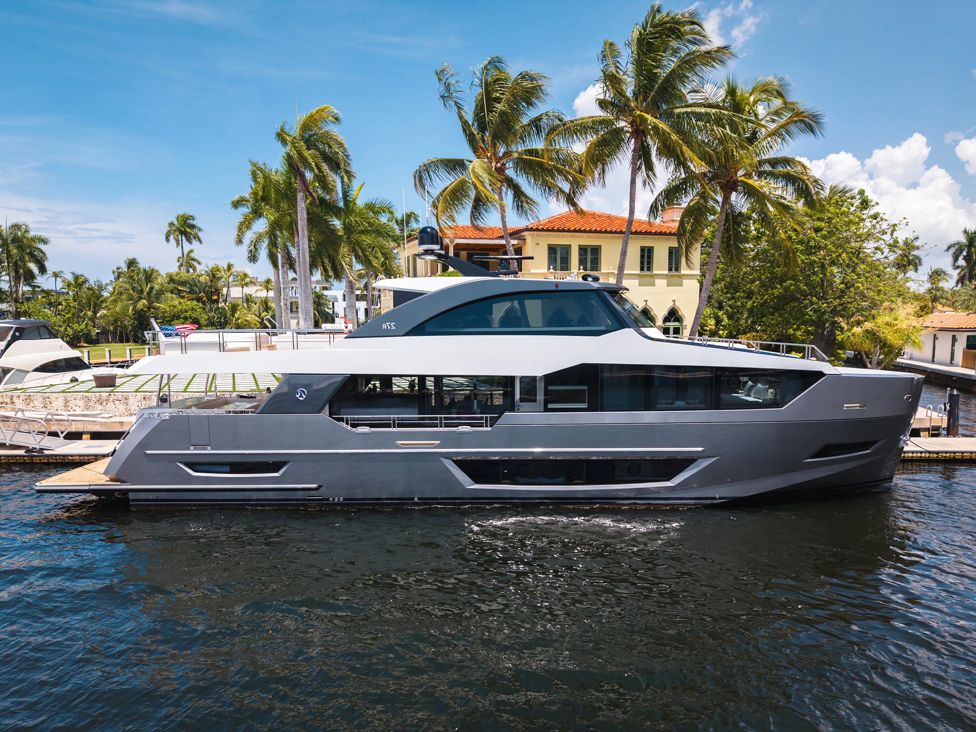 a white yacht in a harbor aboard STILL WATERS Yacht for Sale