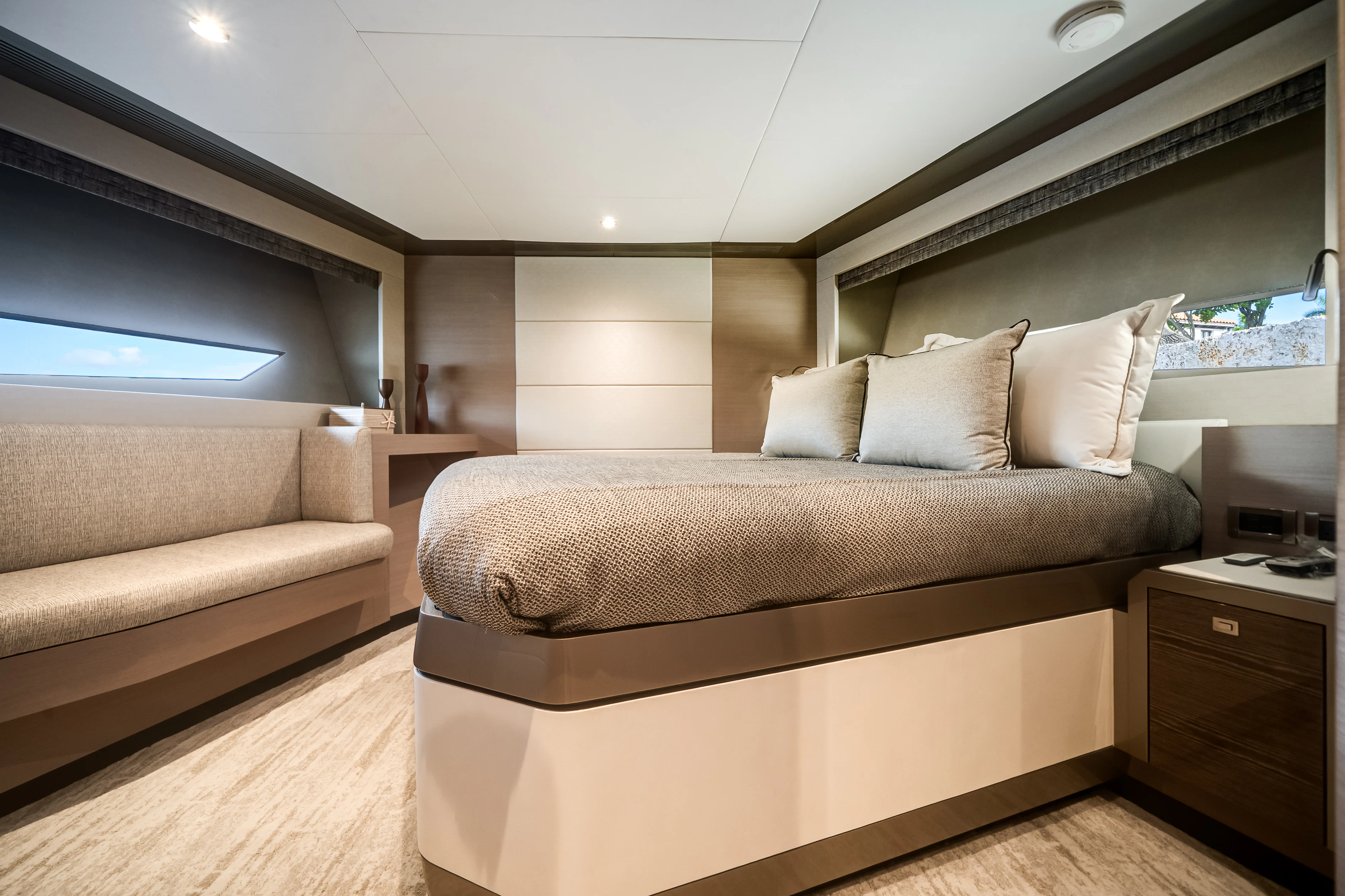 a room with a bed and a couch aboard STILL WATERS Yacht for Sale