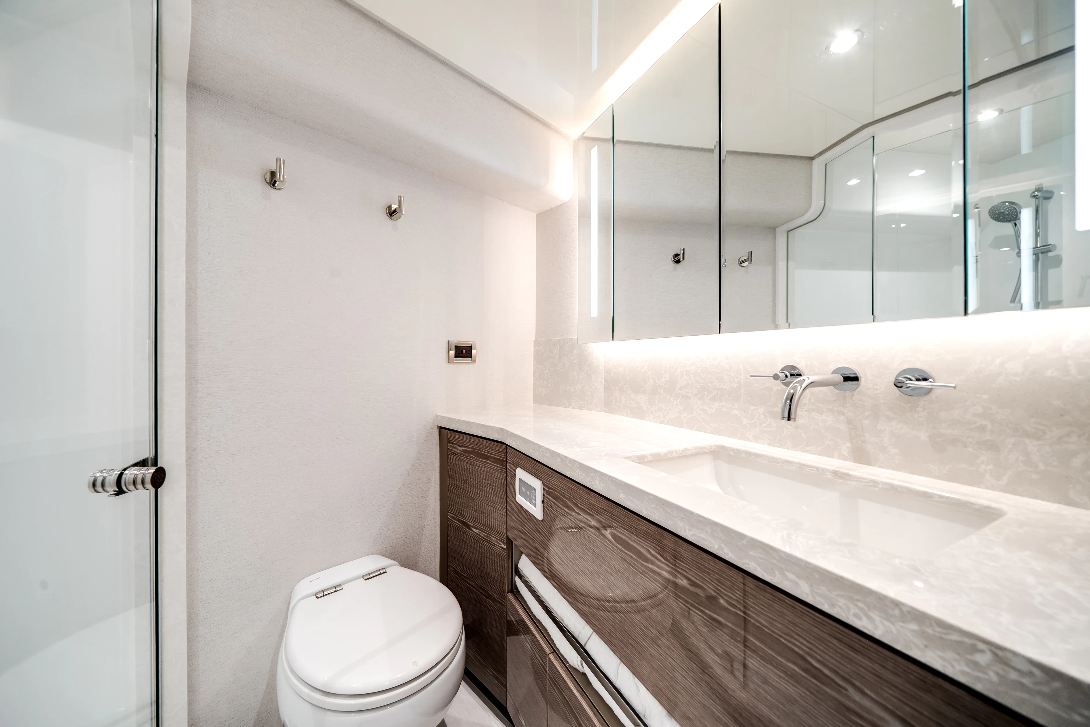 a bathroom with a sink toilet and a mirror aboard STILL WATERS Yacht for Sale