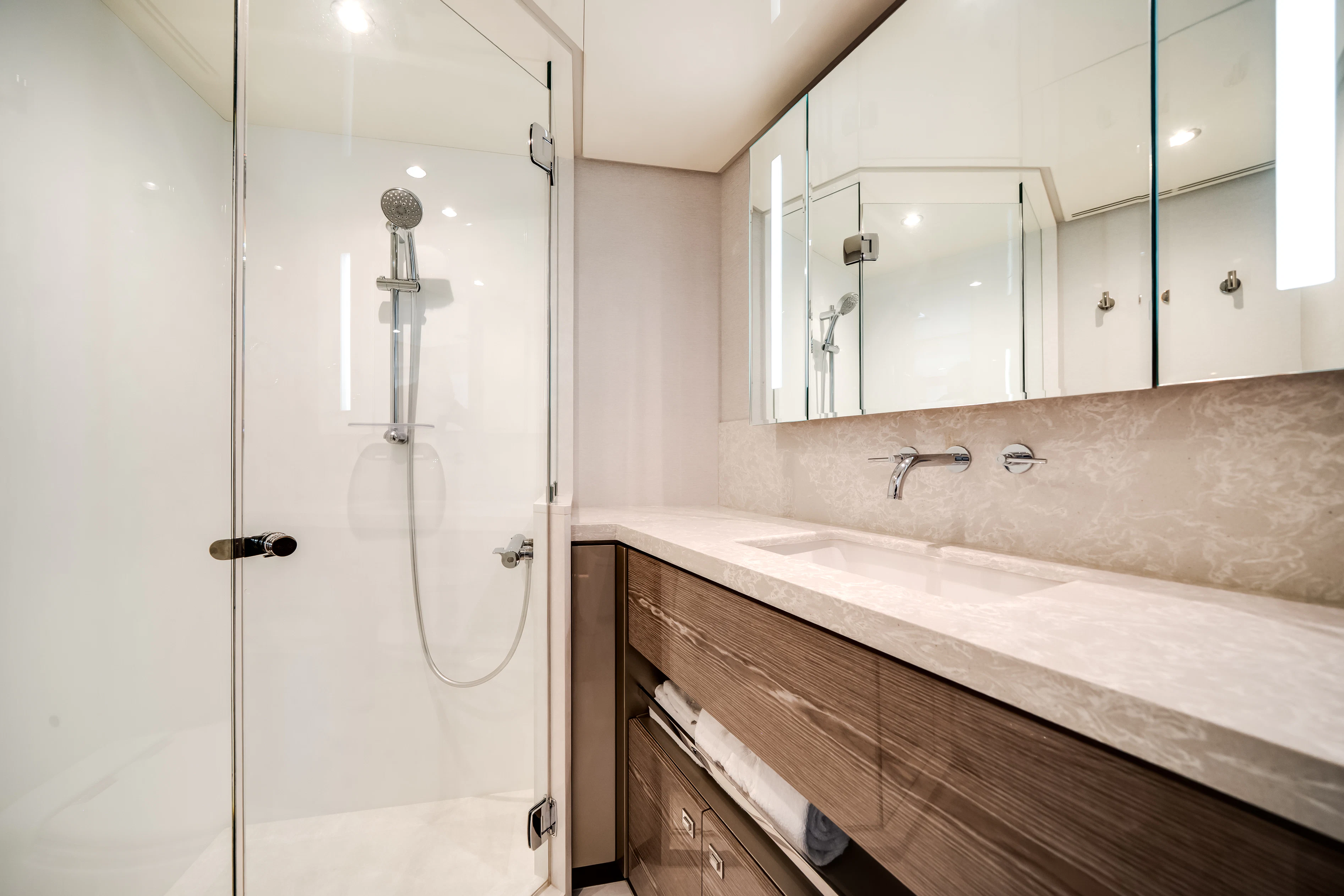 a bathroom with a shower unit and a sink aboard STILL WATERS Yacht for Sale