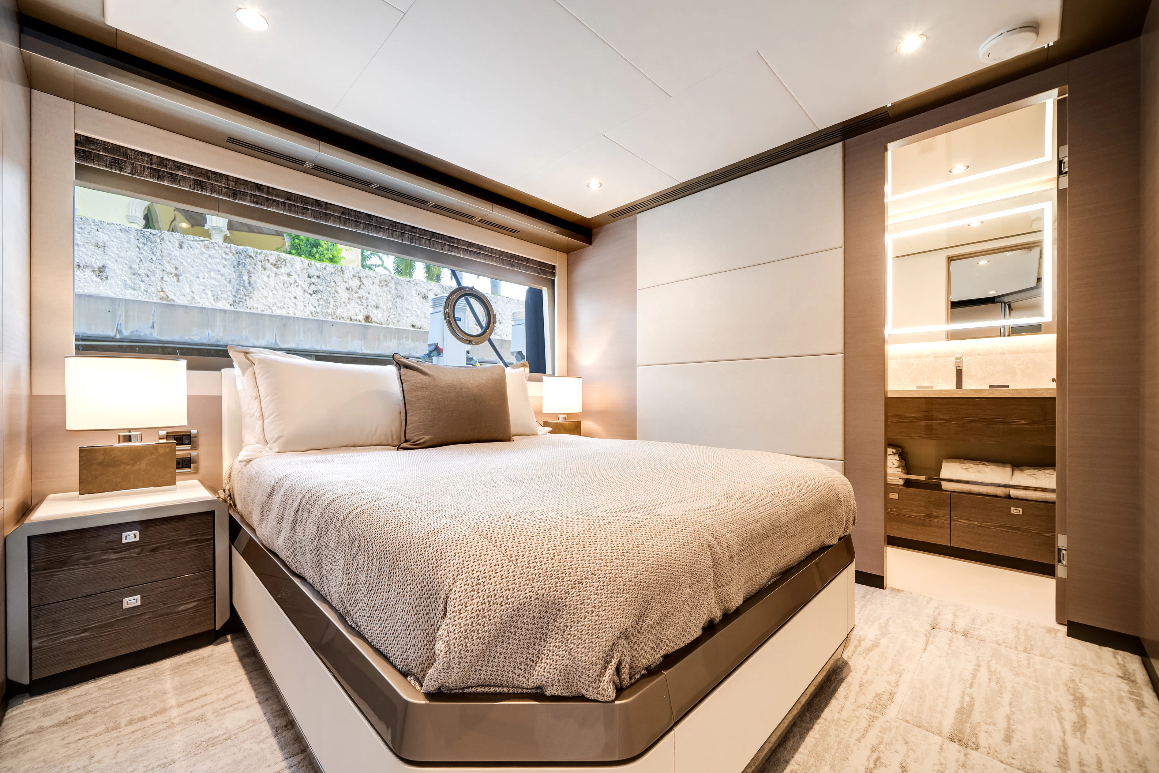 a bedroom with a bed and a desk aboard STILL WATERS Yacht for Sale