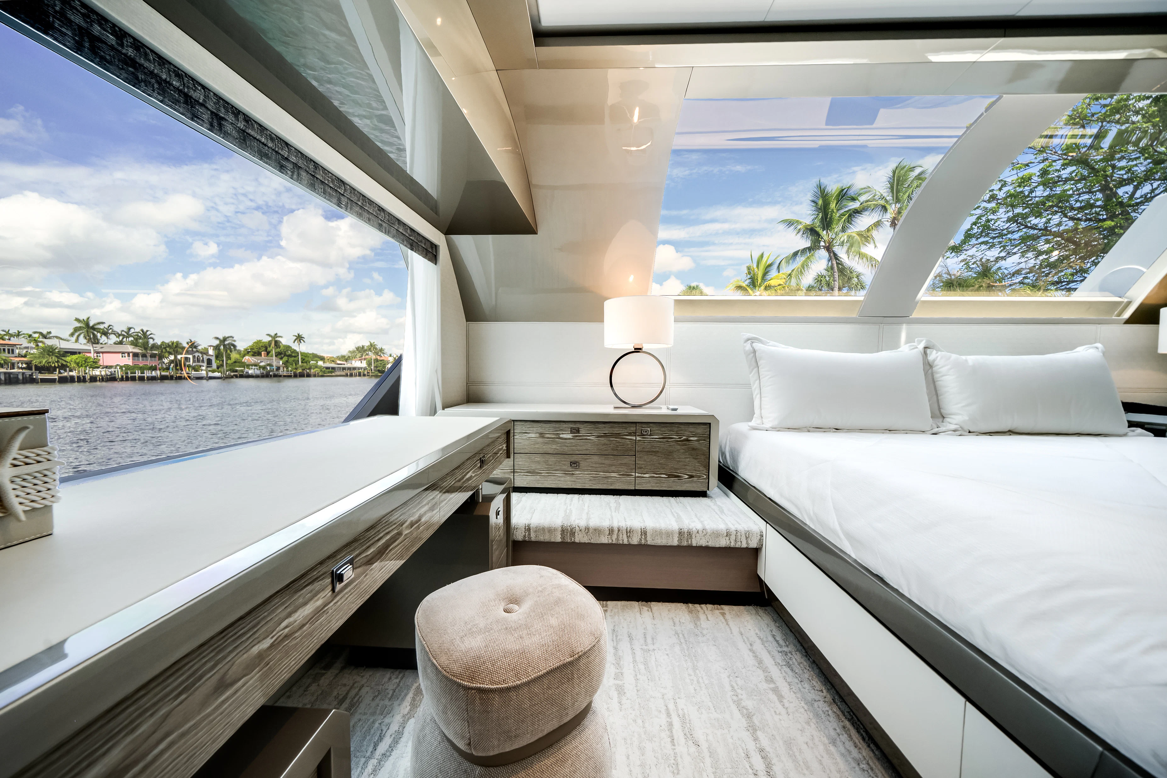 a room with a bed and a large window aboard STILL WATERS Yacht for Sale