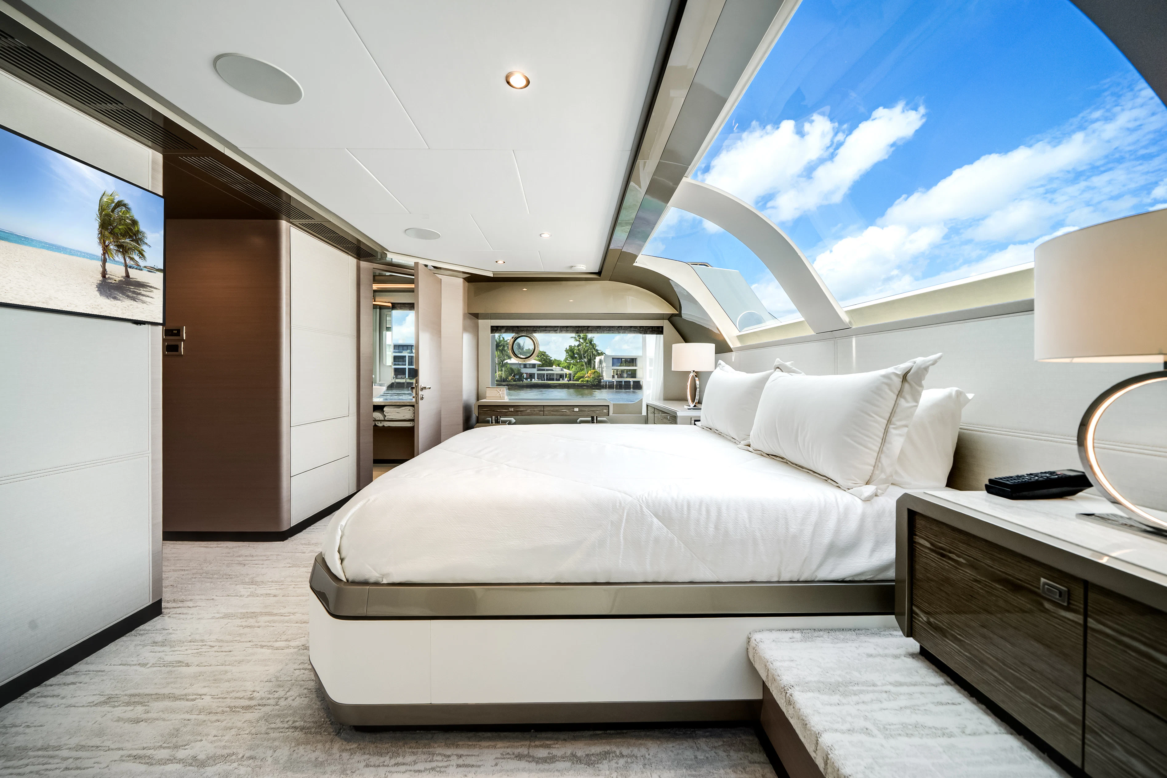 a room with a bed and a window aboard STILL WATERS Yacht for Sale