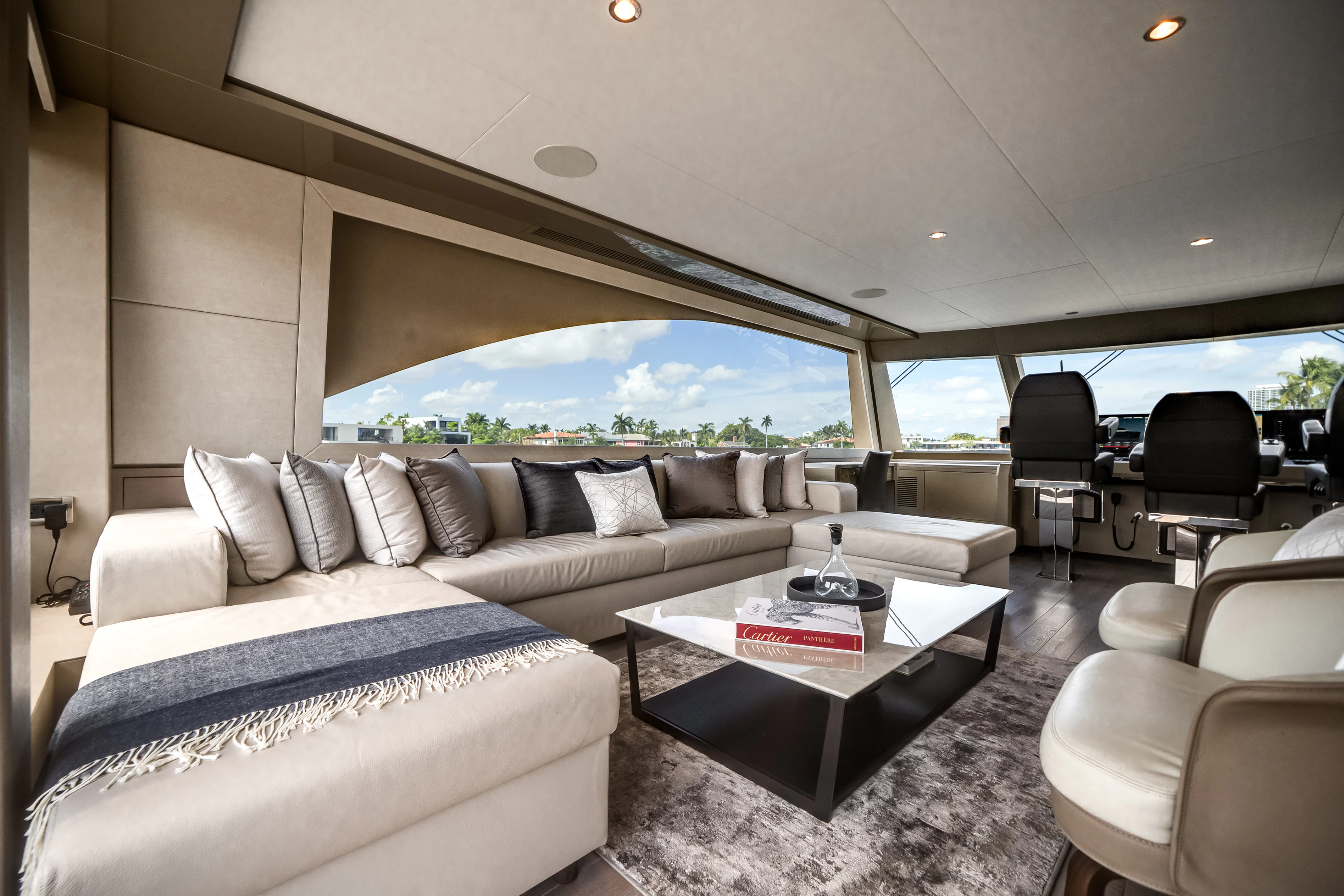 a living room with a large window aboard STILL WATERS Yacht for Sale