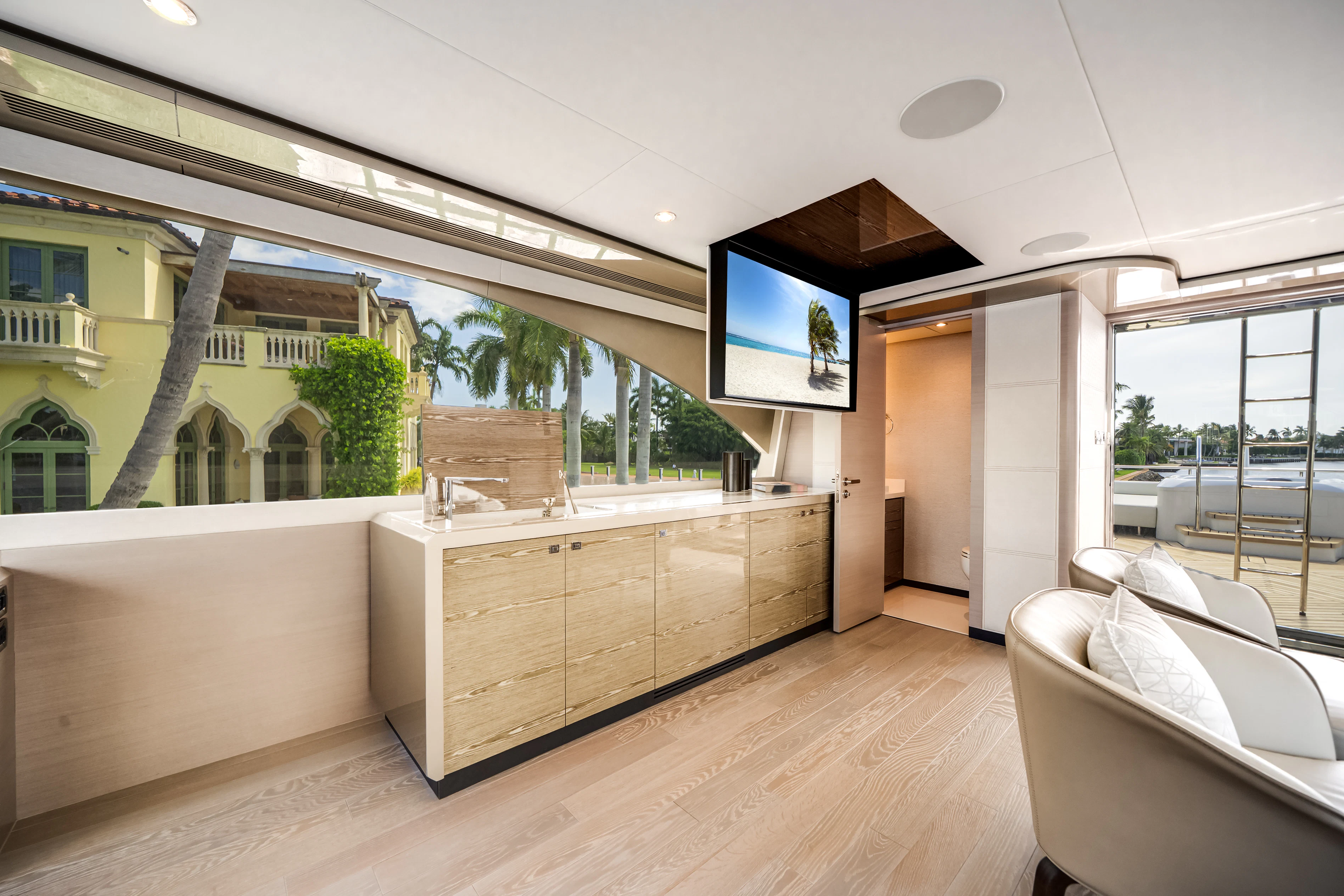 a room with a wood floor and a large window aboard STILL WATERS Yacht for Sale