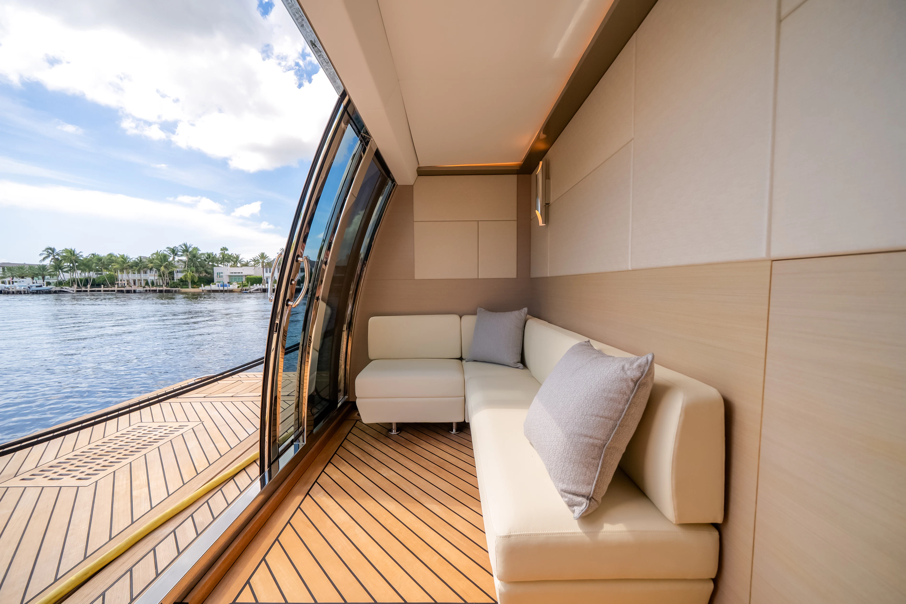 a room with a couch and a view of the water aboard STILL WATERS Yacht for Sale