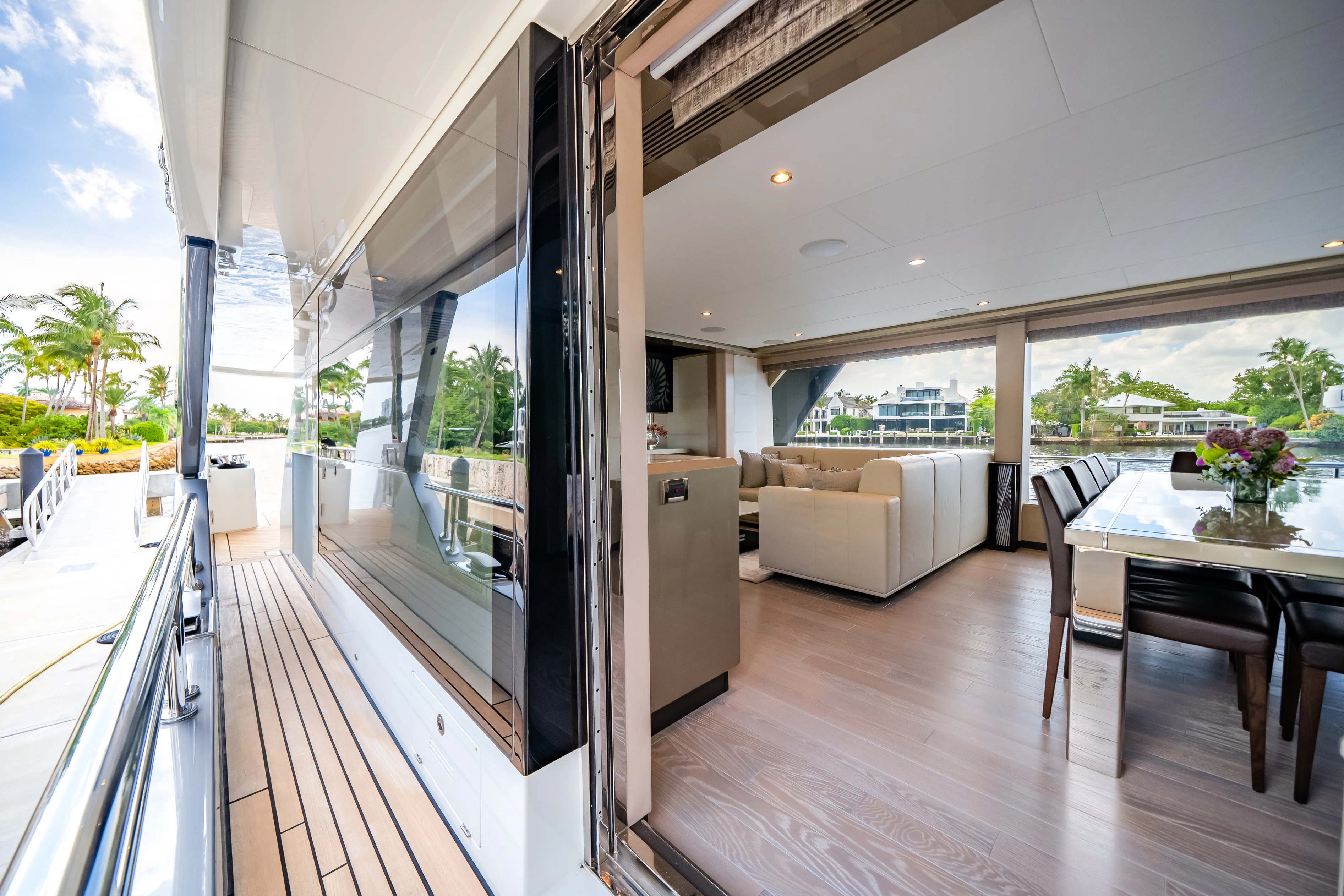 a balcony with a table and chairs aboard STILL WATERS Yacht for Sale