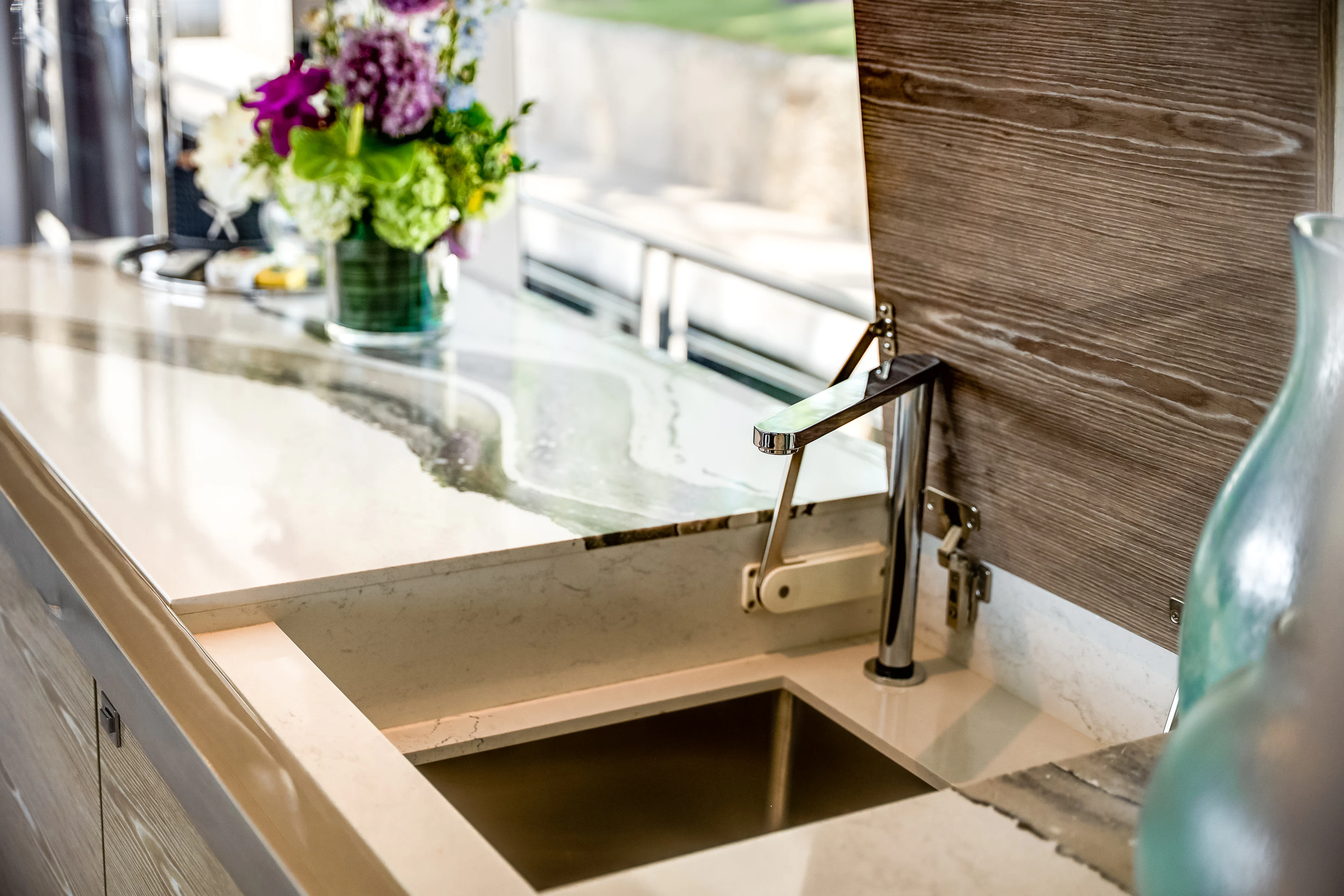 a glass sink with a flower vase aboard STILL WATERS Yacht for Sale
