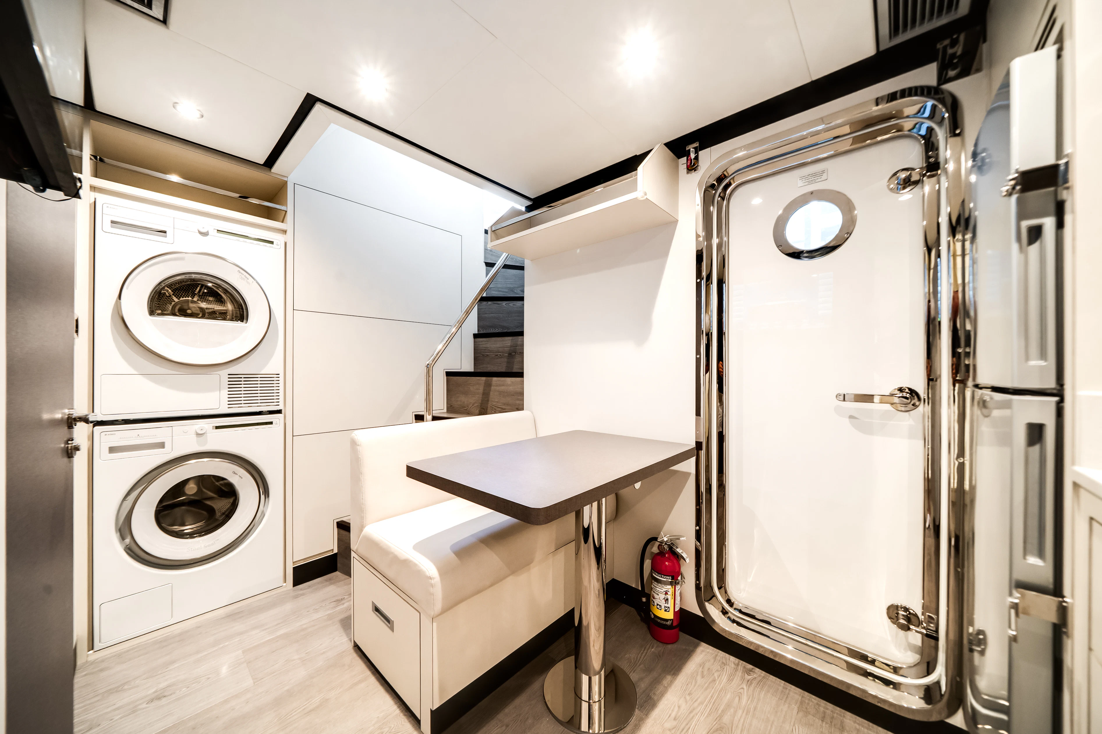 a room with a washing machine and a desk aboard STILL WATERS Yacht for Sale