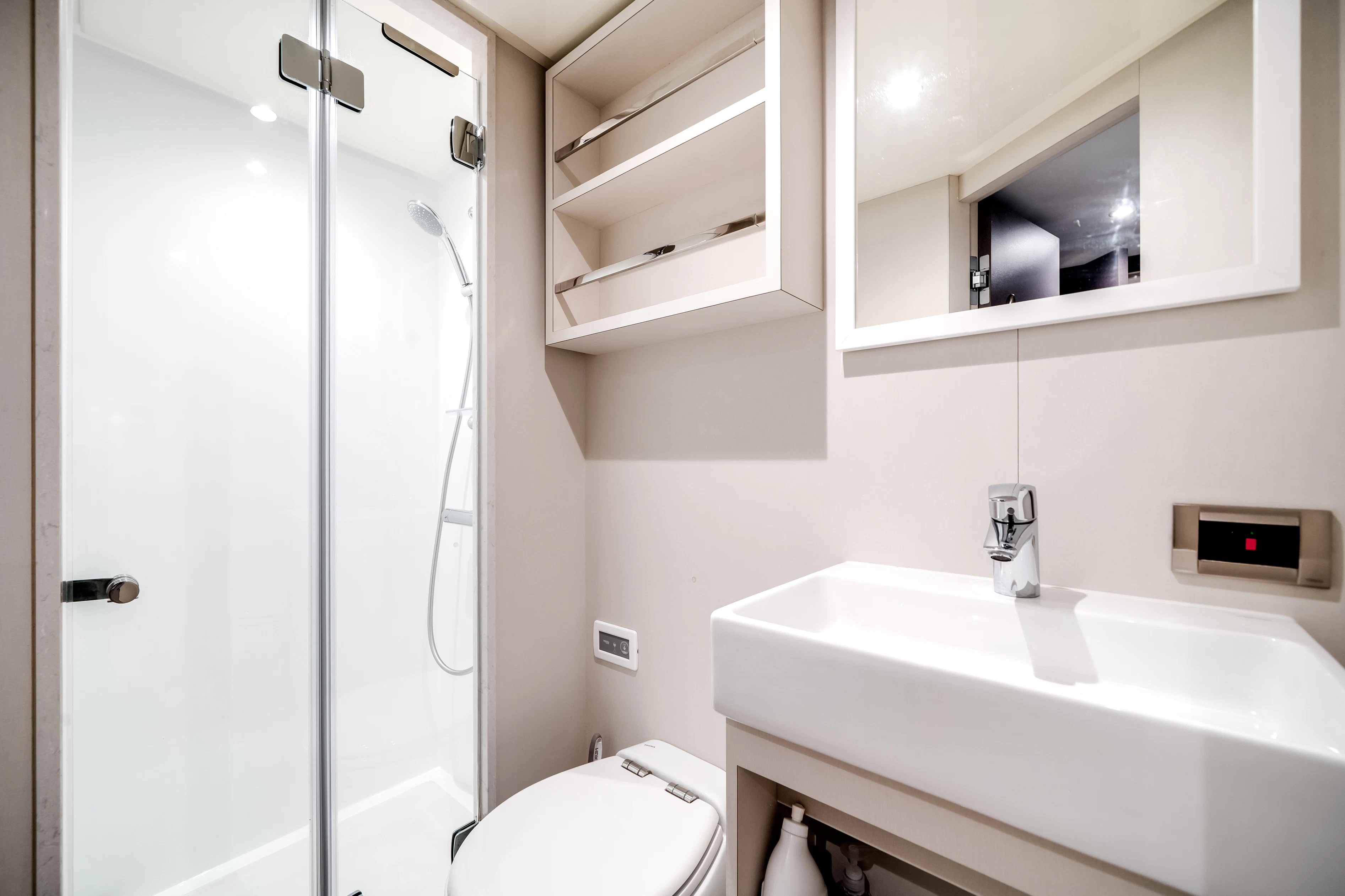 a bathroom with a sink and a shower unit aboard STILL WATERS Yacht for Sale