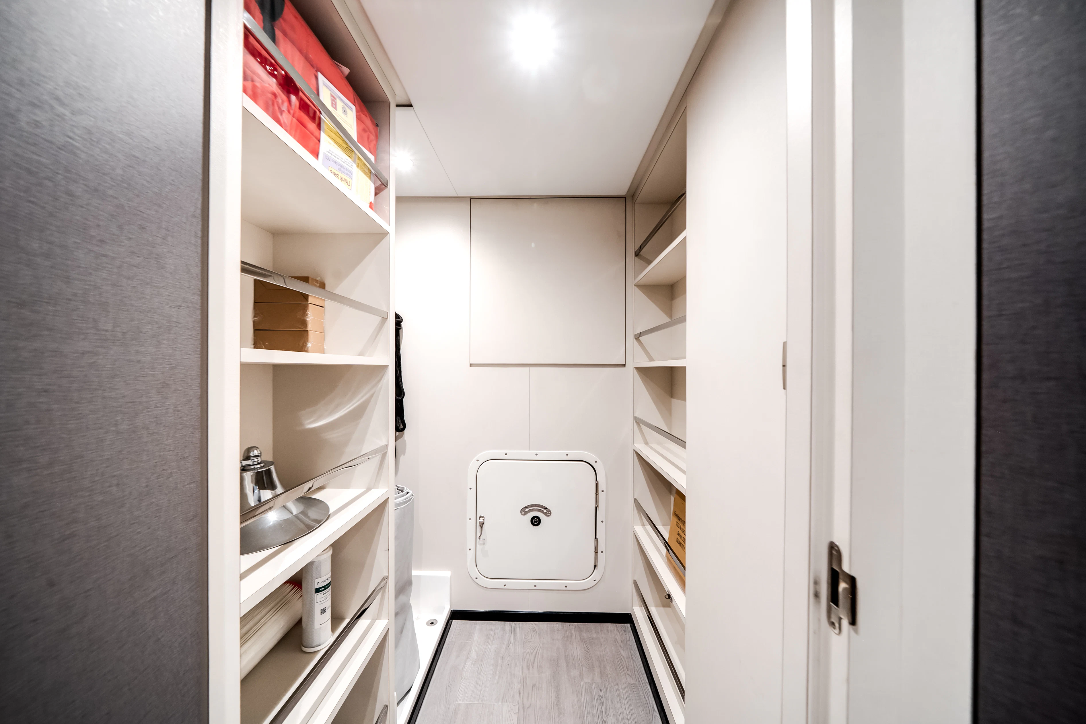 a white room with a shelf and a sink aboard STILL WATERS Yacht for Sale