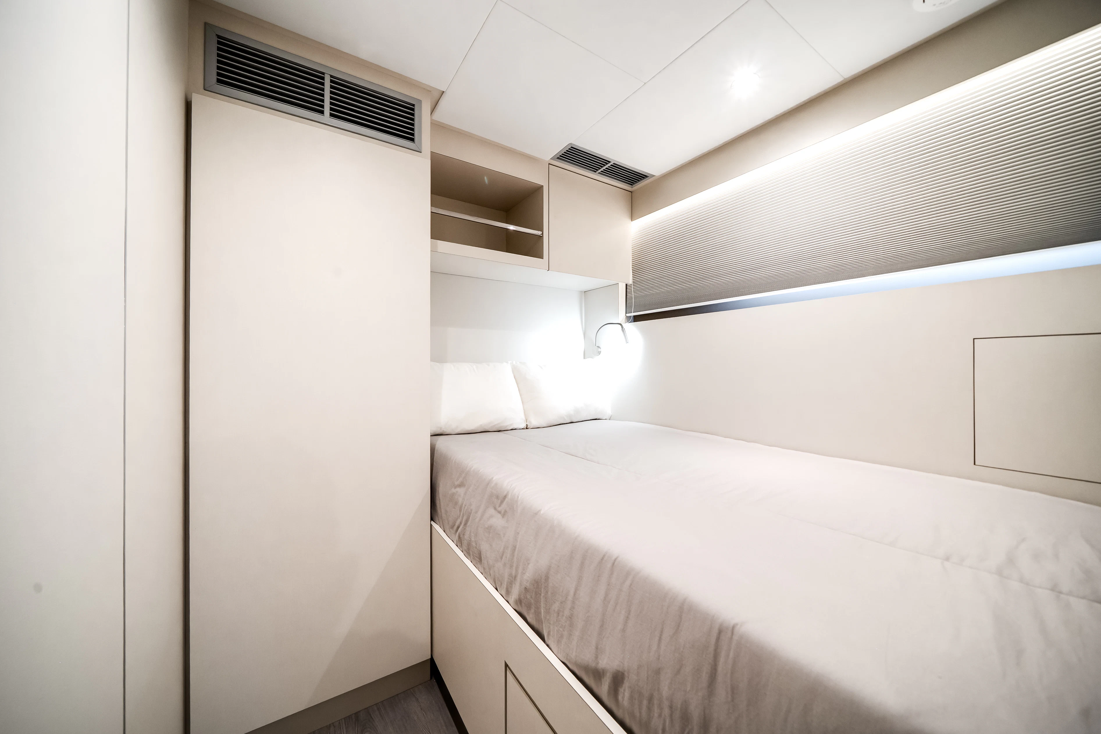 a room with a bed and a shelf aboard STILL WATERS Yacht for Sale