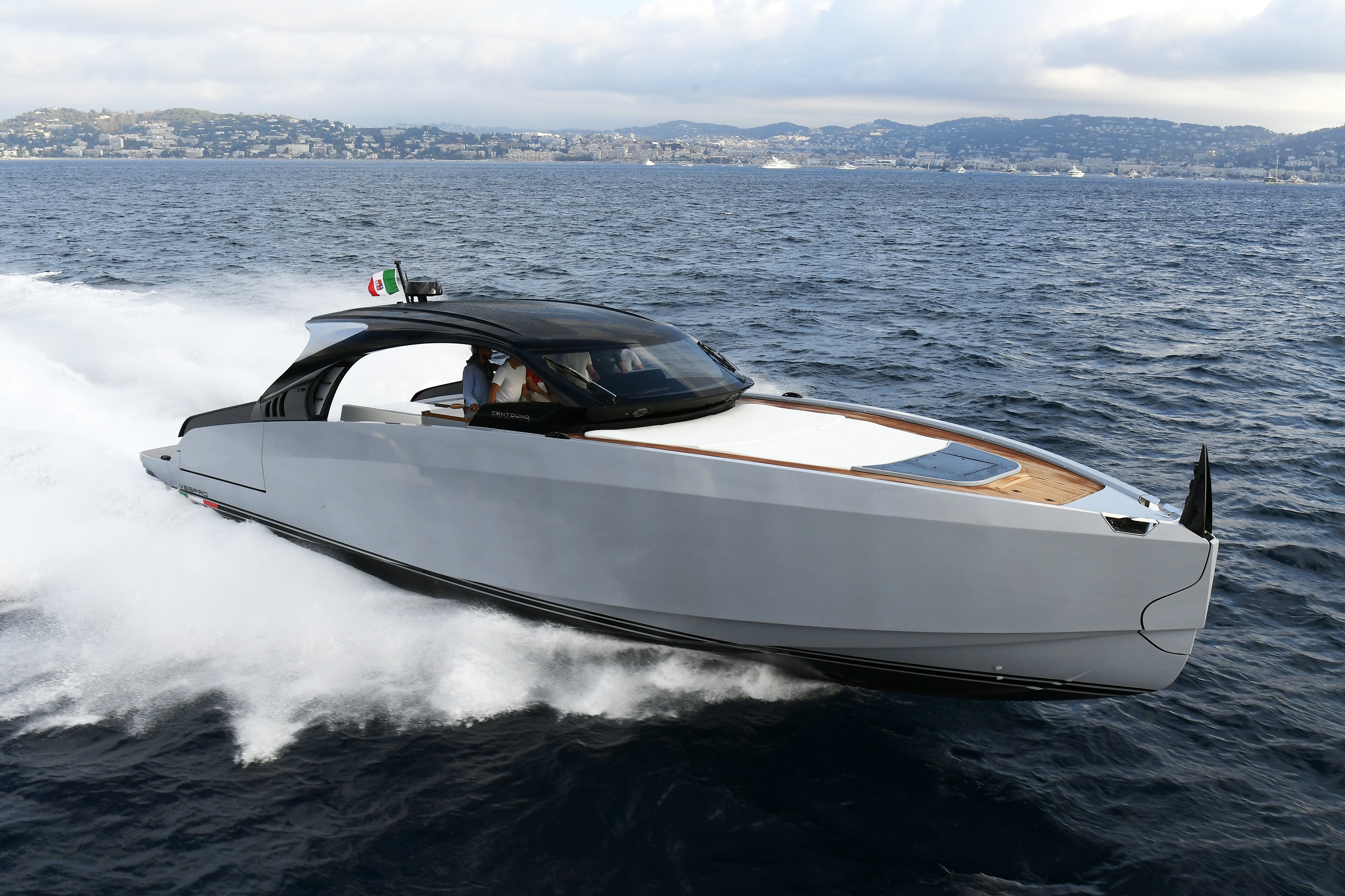 a white speed boat on water aboard VESPRO 55 Yacht for Sale