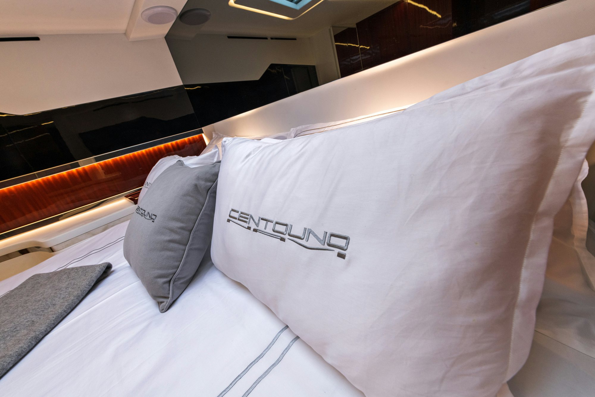 a bed with white sheets aboard VESPRO 55 Yacht for Sale