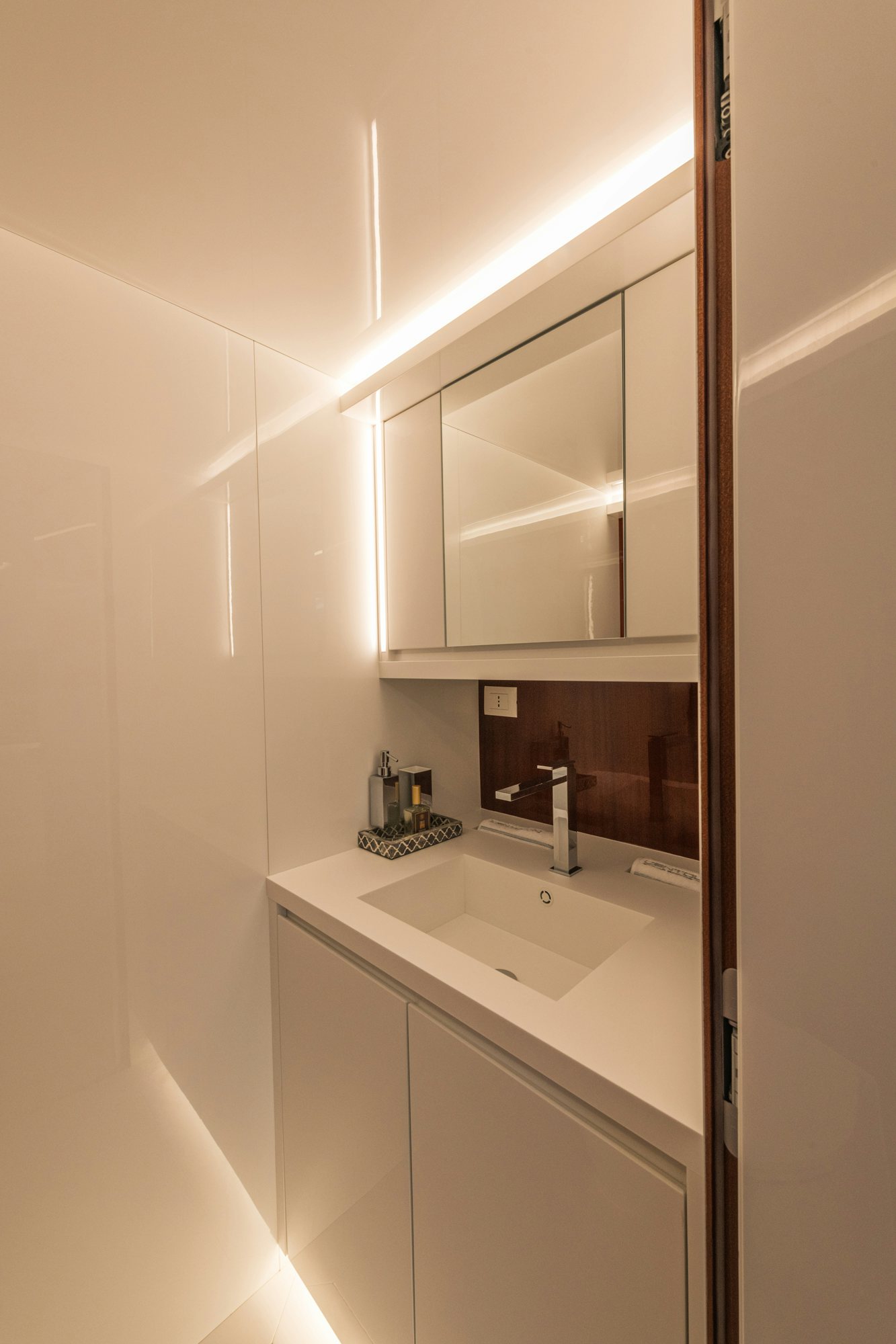 a bathroom with a sink and a mirror aboard VESPRO 55 Yacht for Sale
