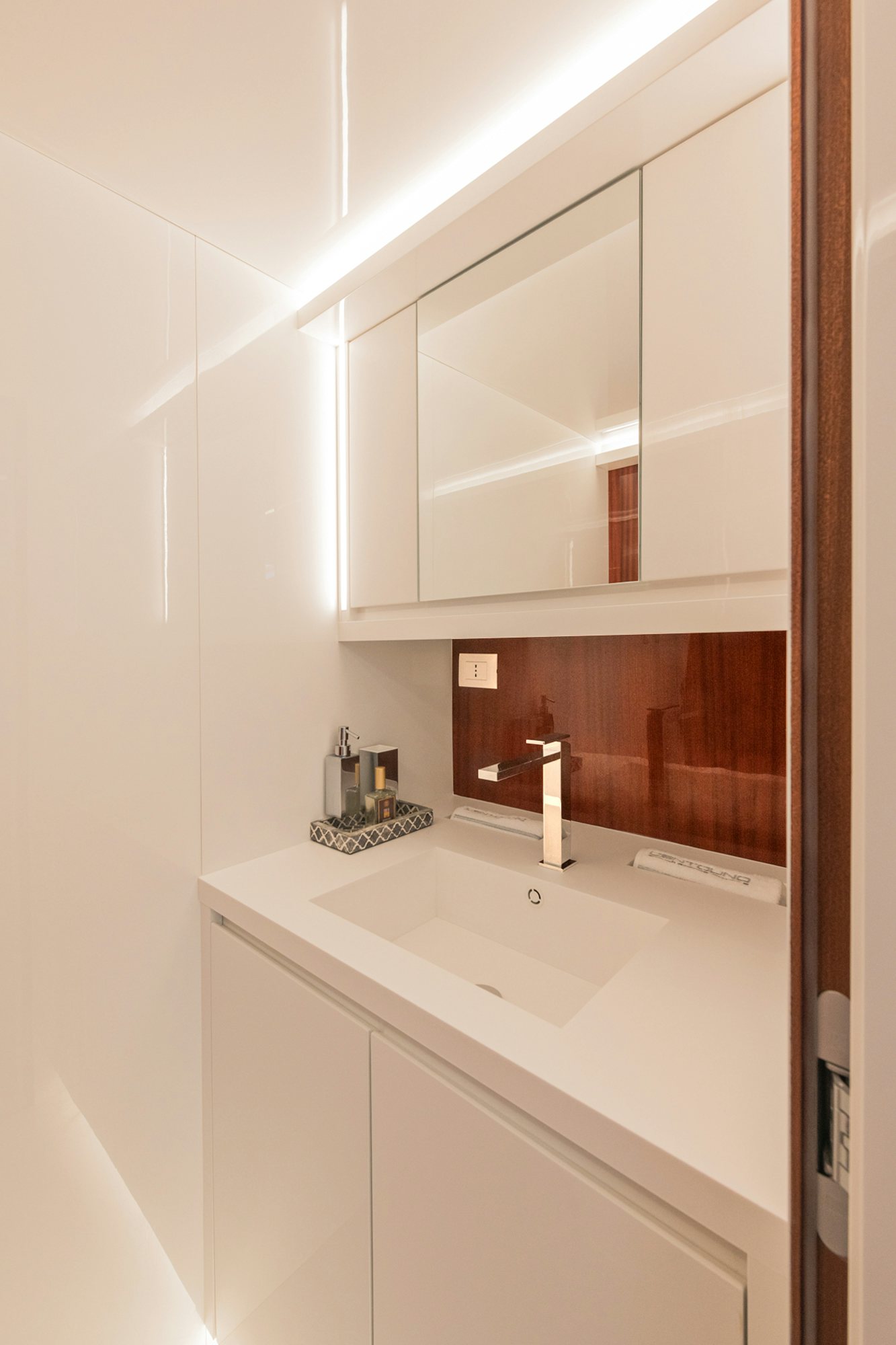 a bathroom with a sink and cabinets aboard VESPRO 55 Yacht for Sale
