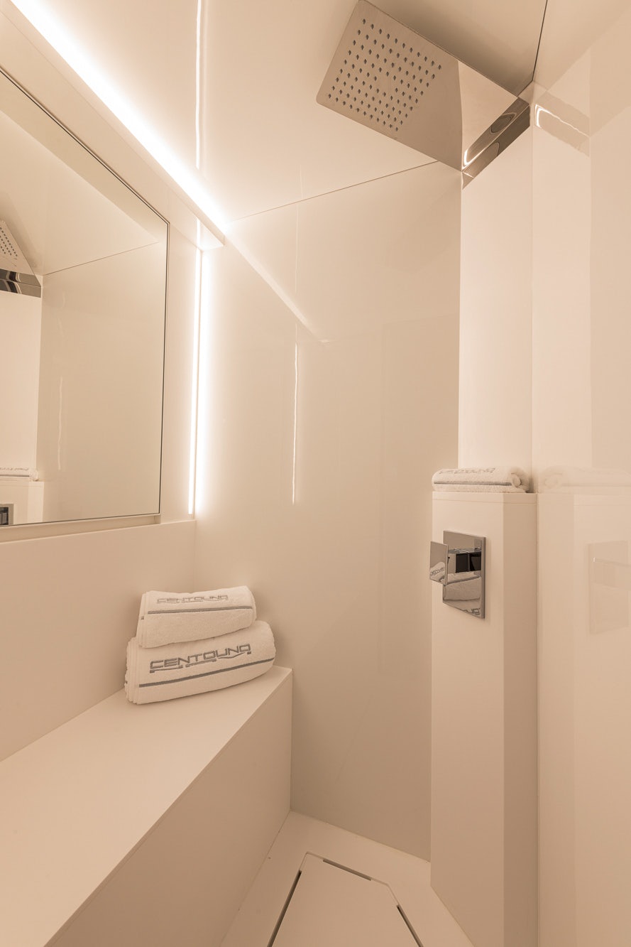 a white wall with a telephone and a white box on it aboard VESPRO 55 Yacht for Sale