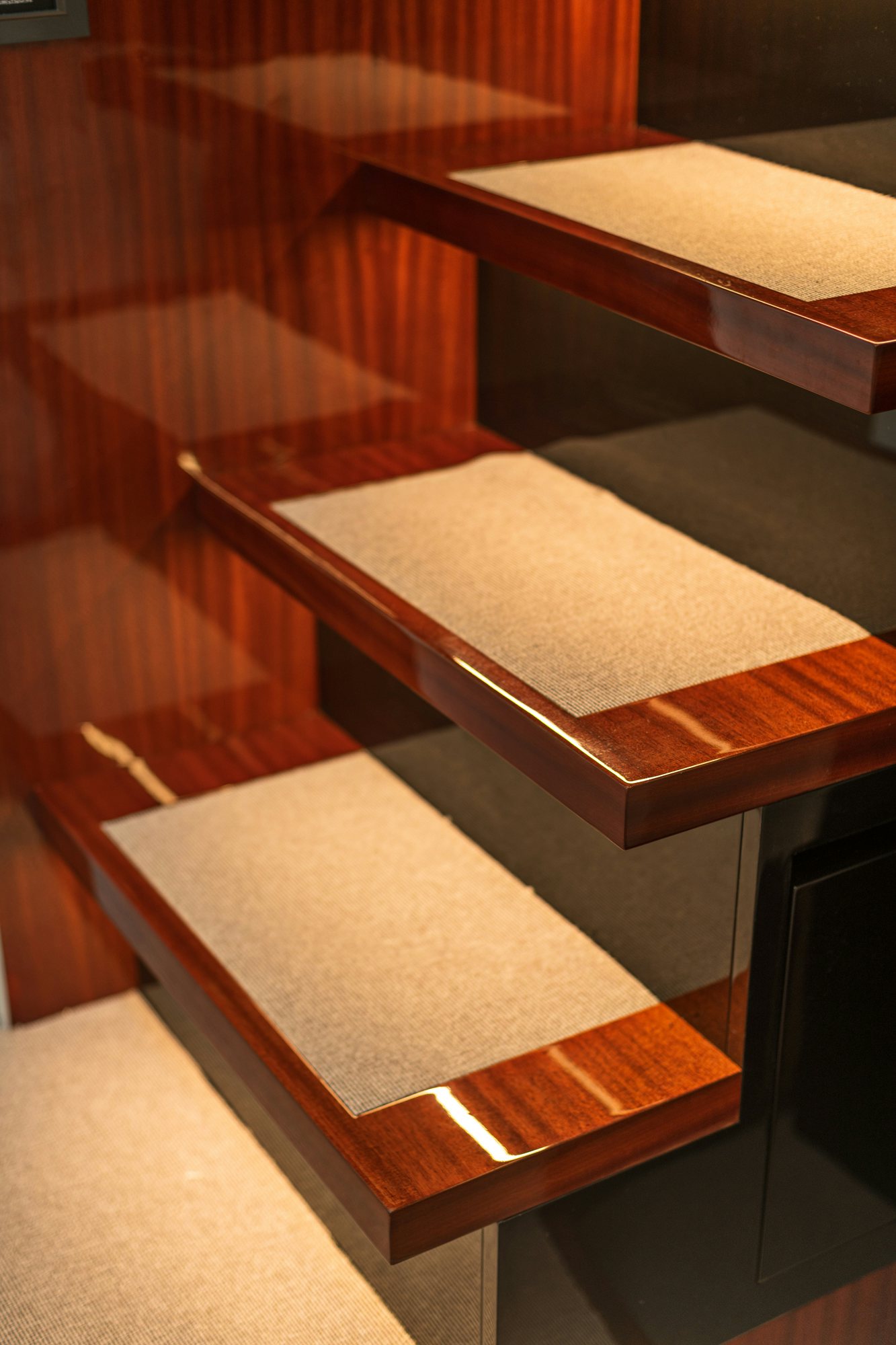 a set of wooden stairs aboard VESPRO 55 Yacht for Sale