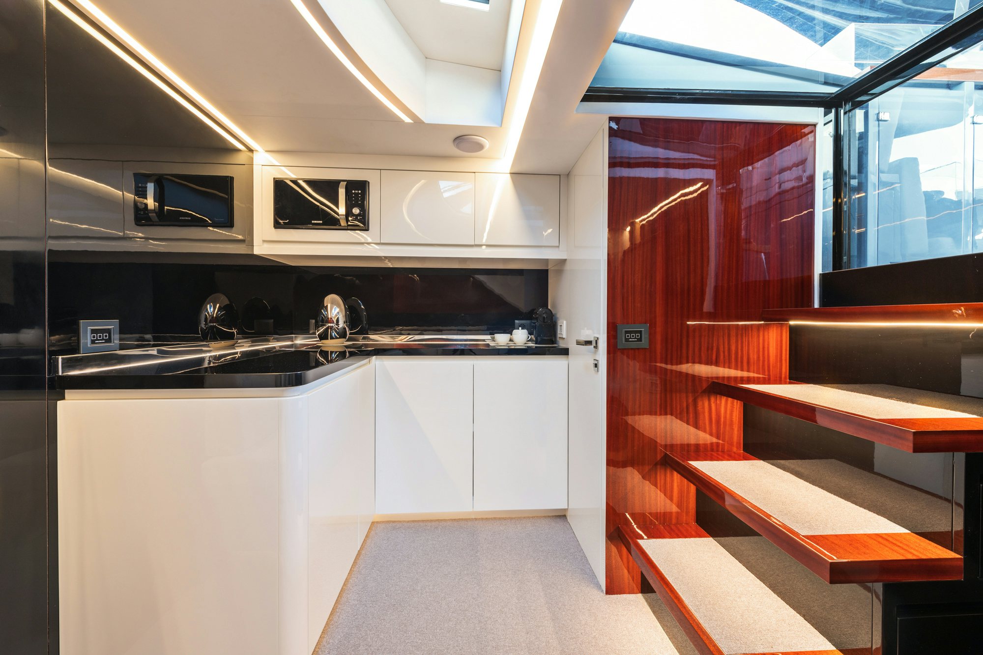a kitchen with a countertop sink and cabinets aboard VESPRO 55 Yacht for Sale