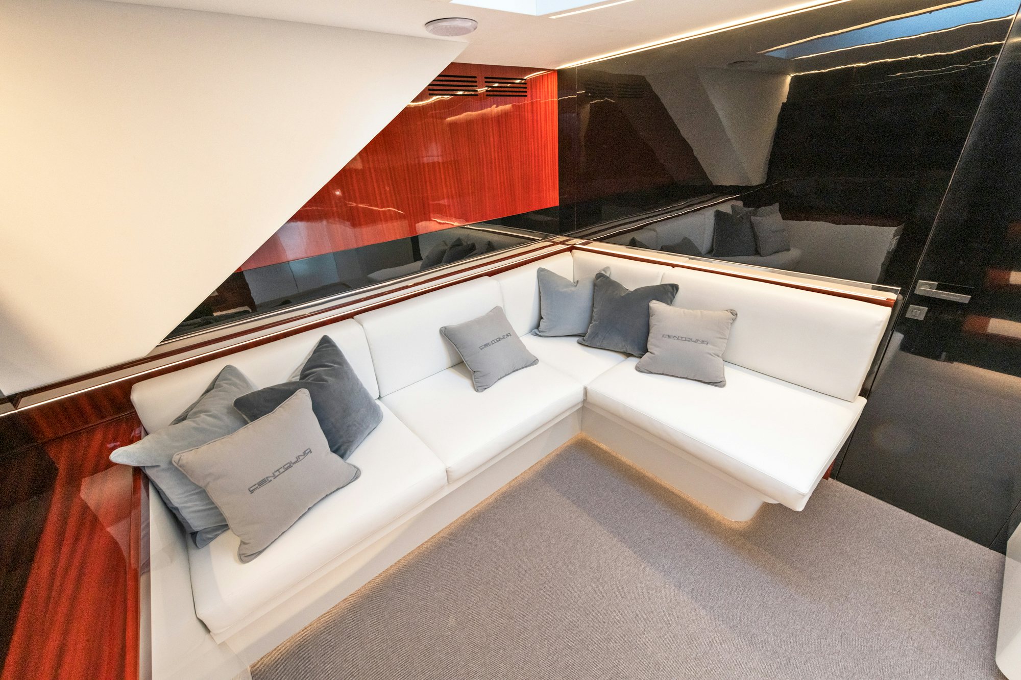 a room with a bed and pillows aboard VESPRO 55 Yacht for Sale