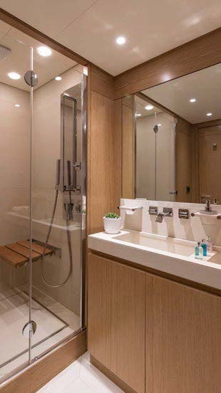 a bathroom with a shower unit and a sink aboard RINI V Yacht for Charter