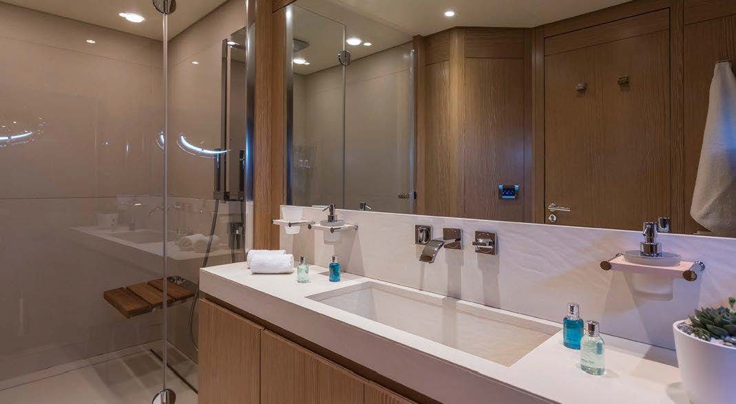 a bathroom with a large mirror aboard RINI V Yacht for Charter