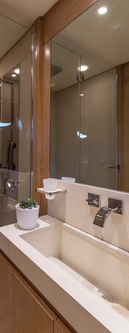 a bathroom with a large mirror aboard RINI V Yacht for Charter