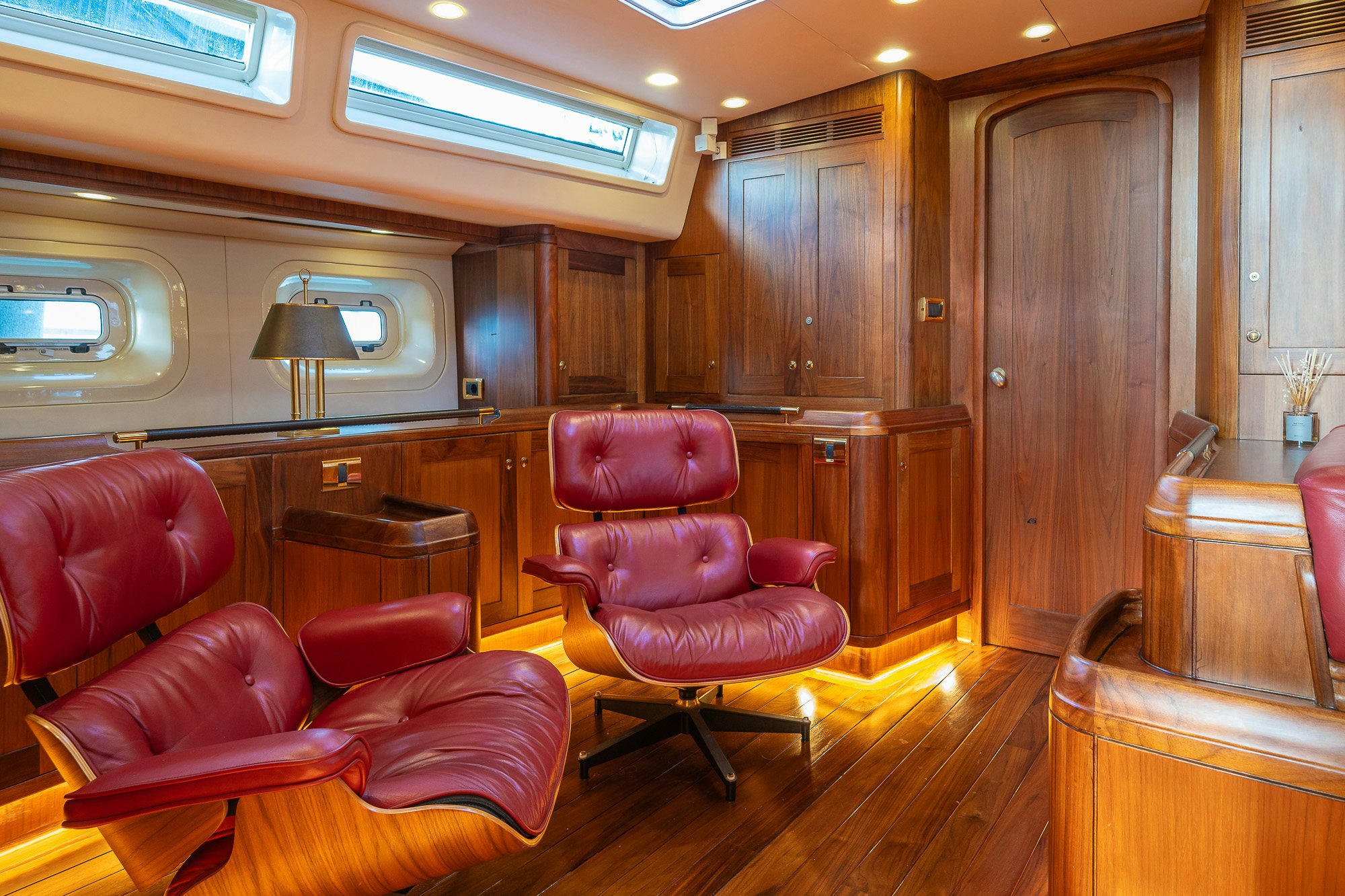 a room with wooden cabinets and a wood floor aboard ADESA Yacht for Sale