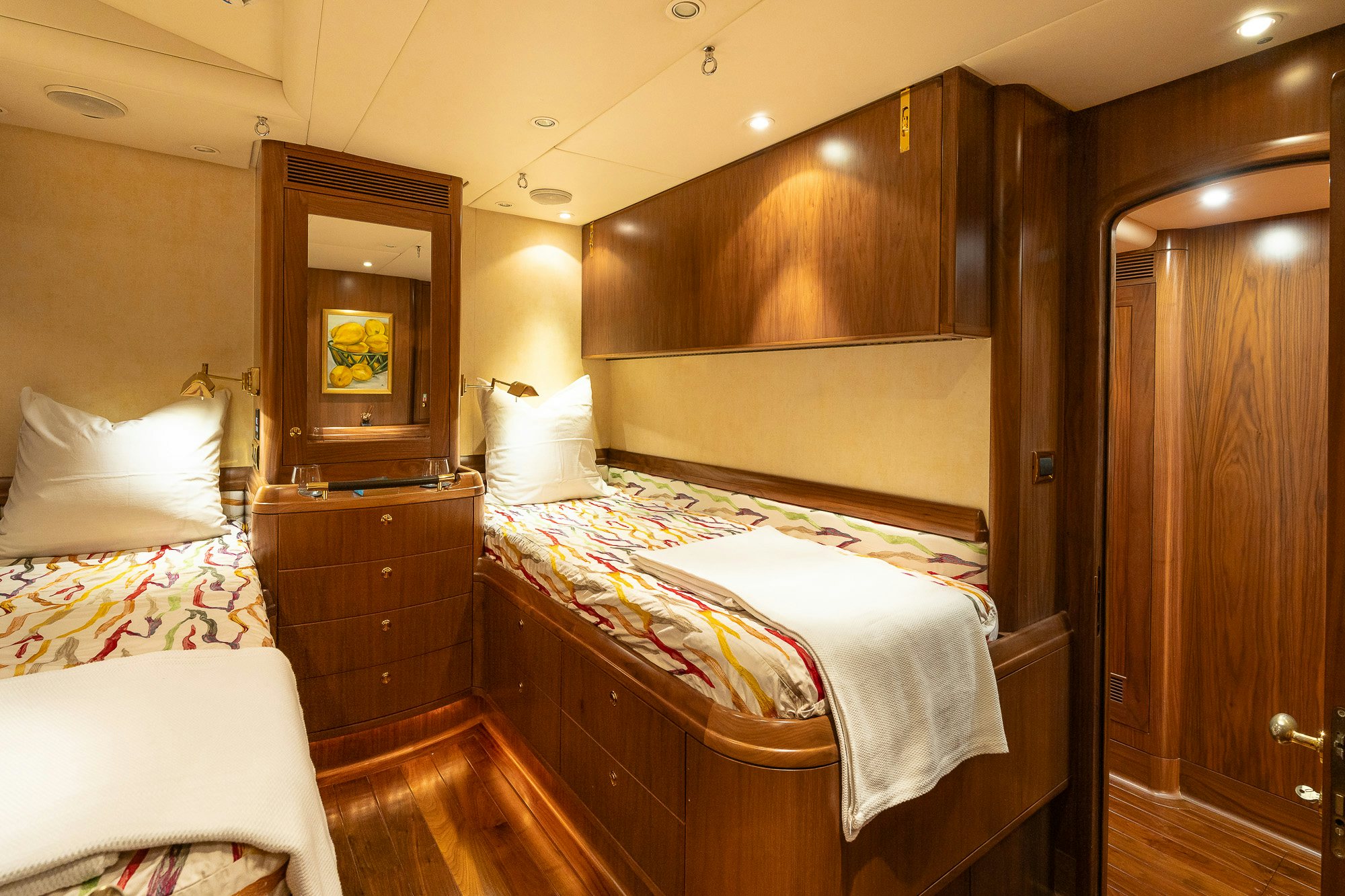 a room with a bed and a mirror aboard ADESA Yacht for Sale