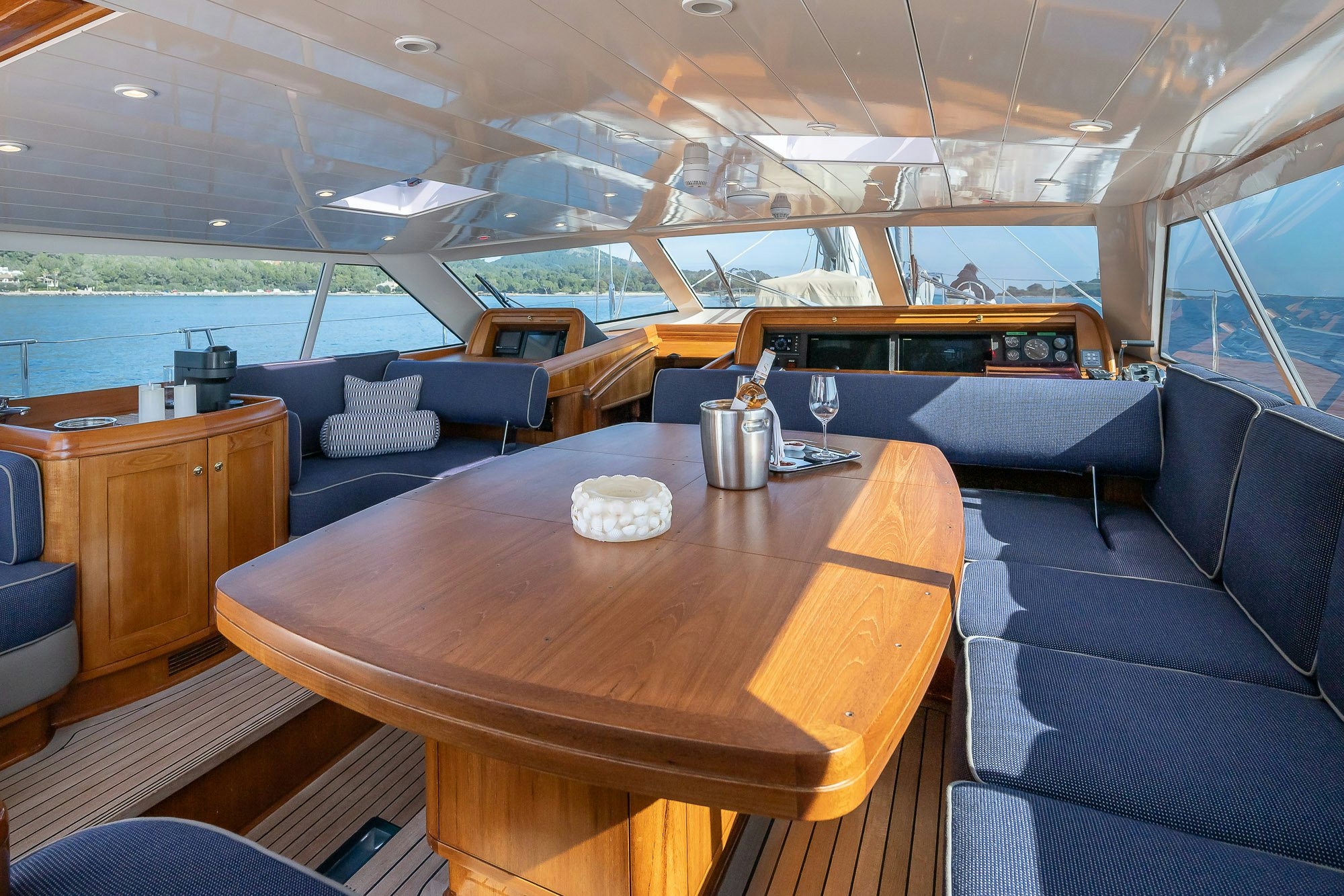 a large room with a table and chairs aboard ADESA Yacht for Sale