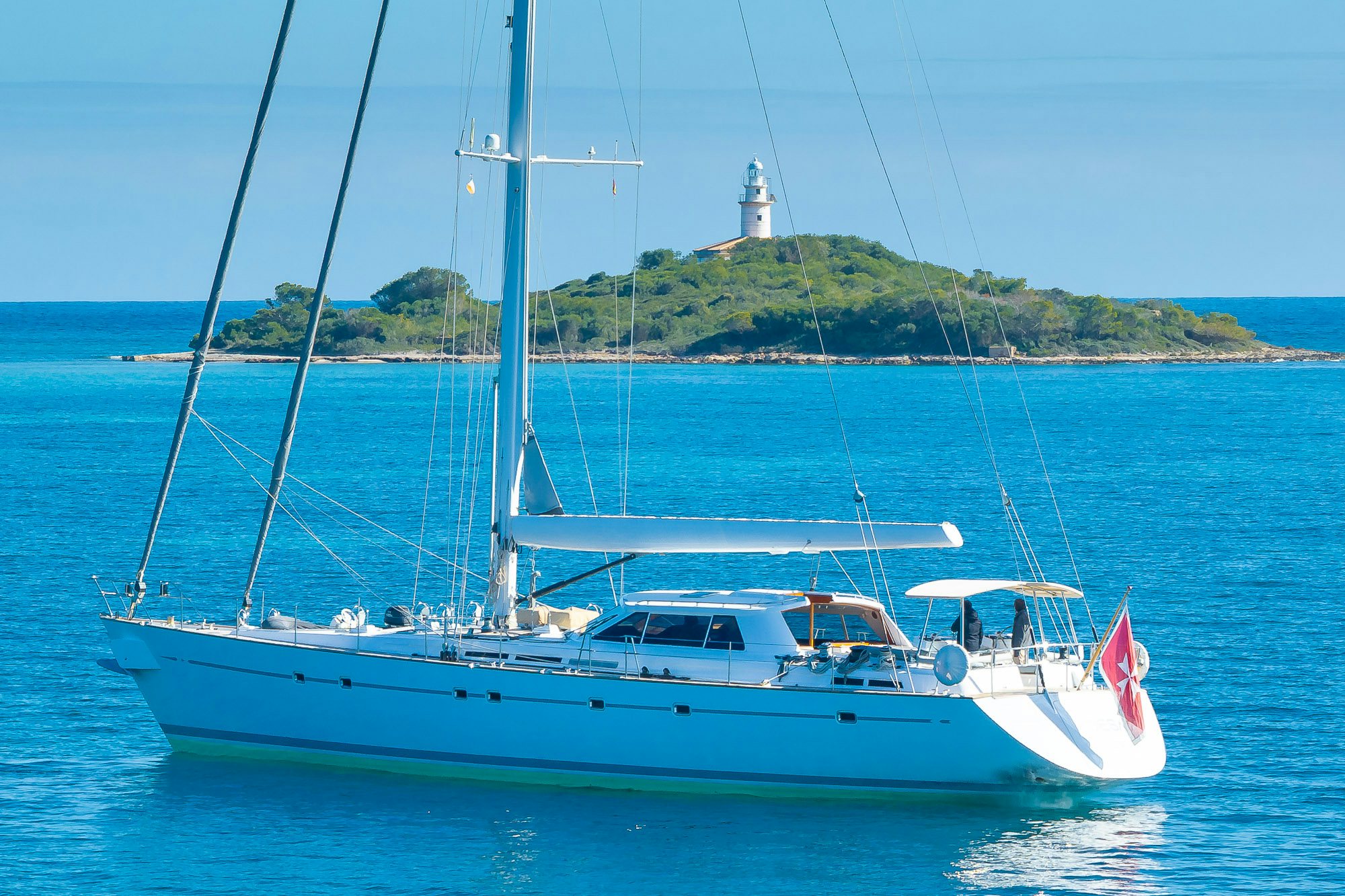 a white boat in the water aboard ADESA Yacht for Sale