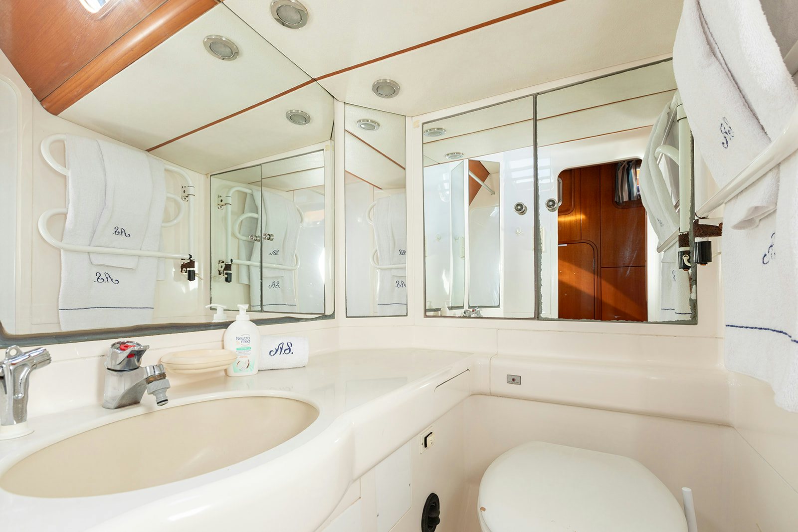 a bathroom with a large mirror aboard DAG Yacht for Sale