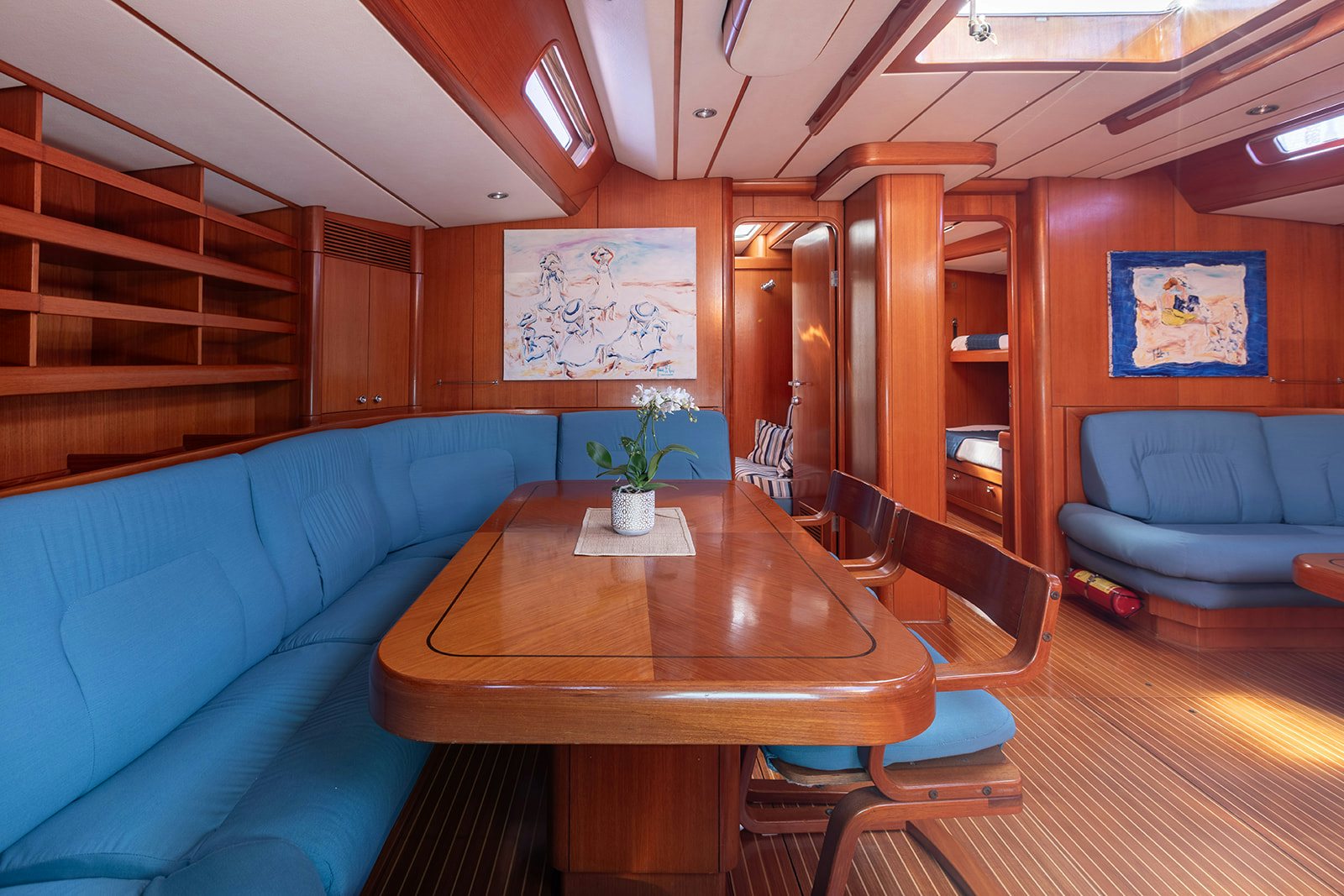 a living room with a couch and a table aboard DAG Yacht for Sale