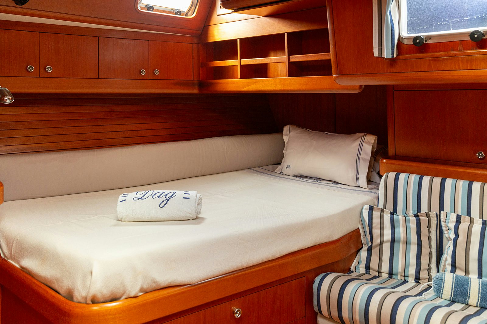 a bed with pillows aboard DAG Yacht for Sale