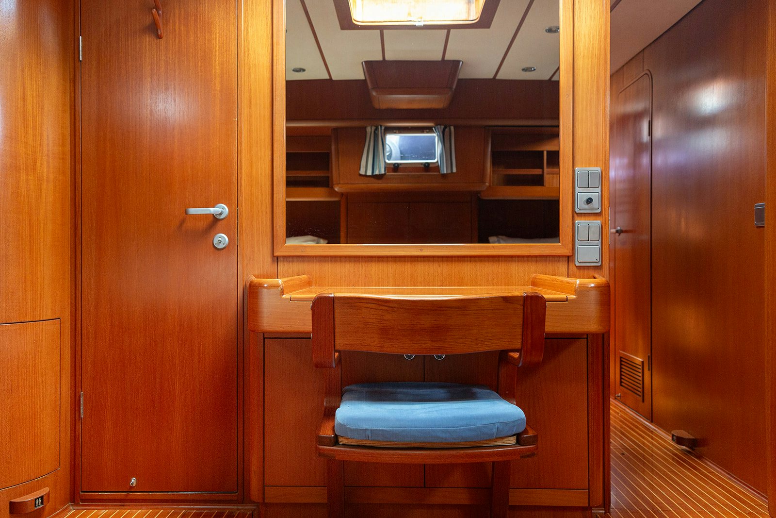 a wooden desk in a room aboard DAG Yacht for Sale