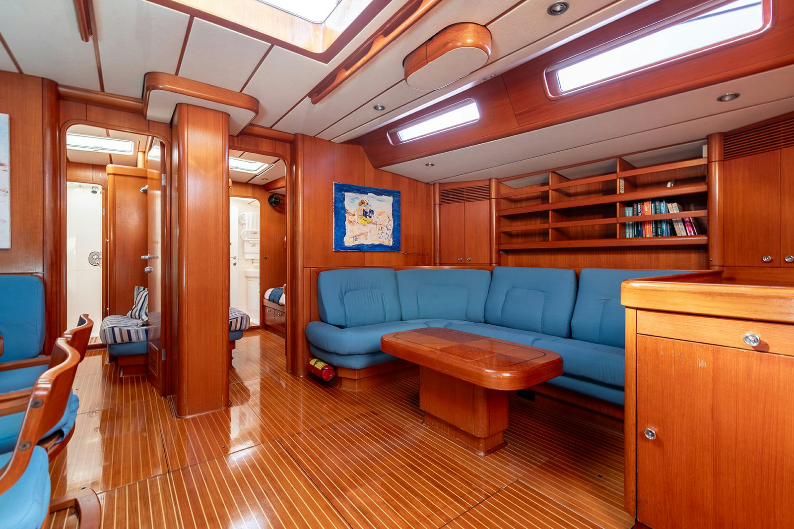 a room with a couch and a table aboard DAG Yacht for Sale