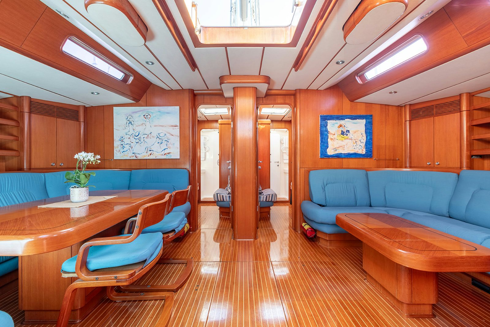 a room with a table and chairs aboard DAG Yacht for Sale