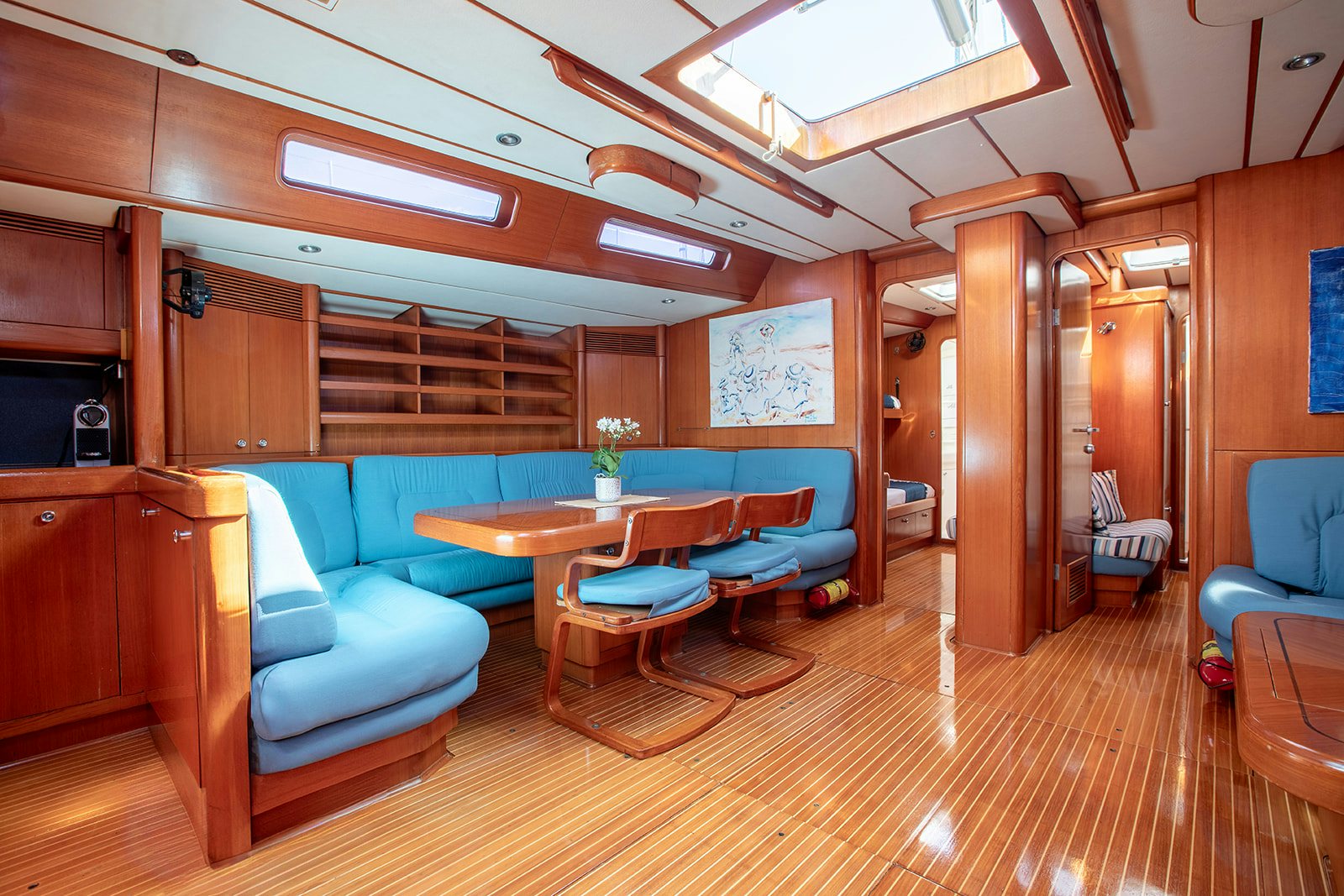 a room with a table and chairs aboard DAG Yacht for Sale