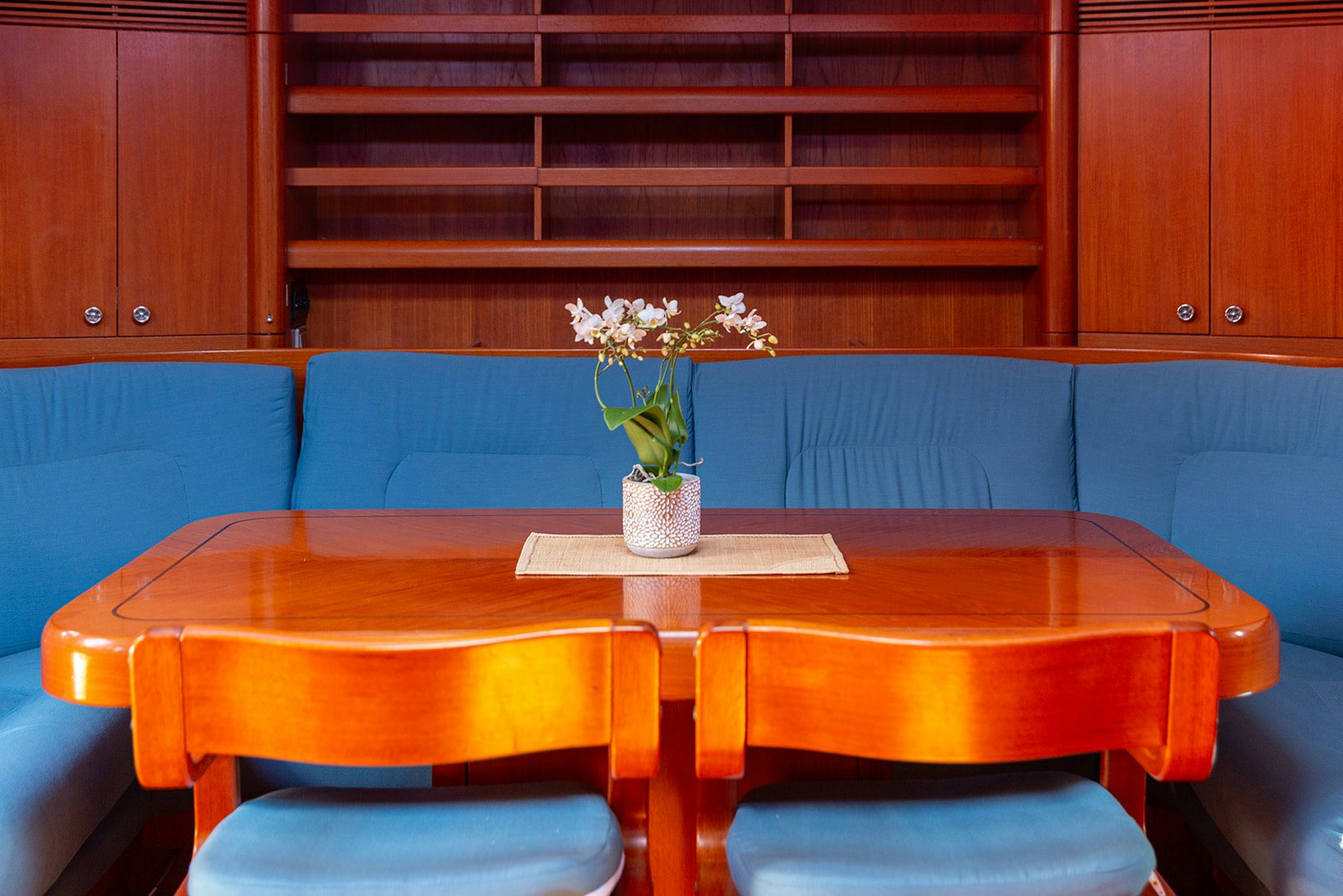 a vase of flowers on a table aboard DAG Yacht for Sale